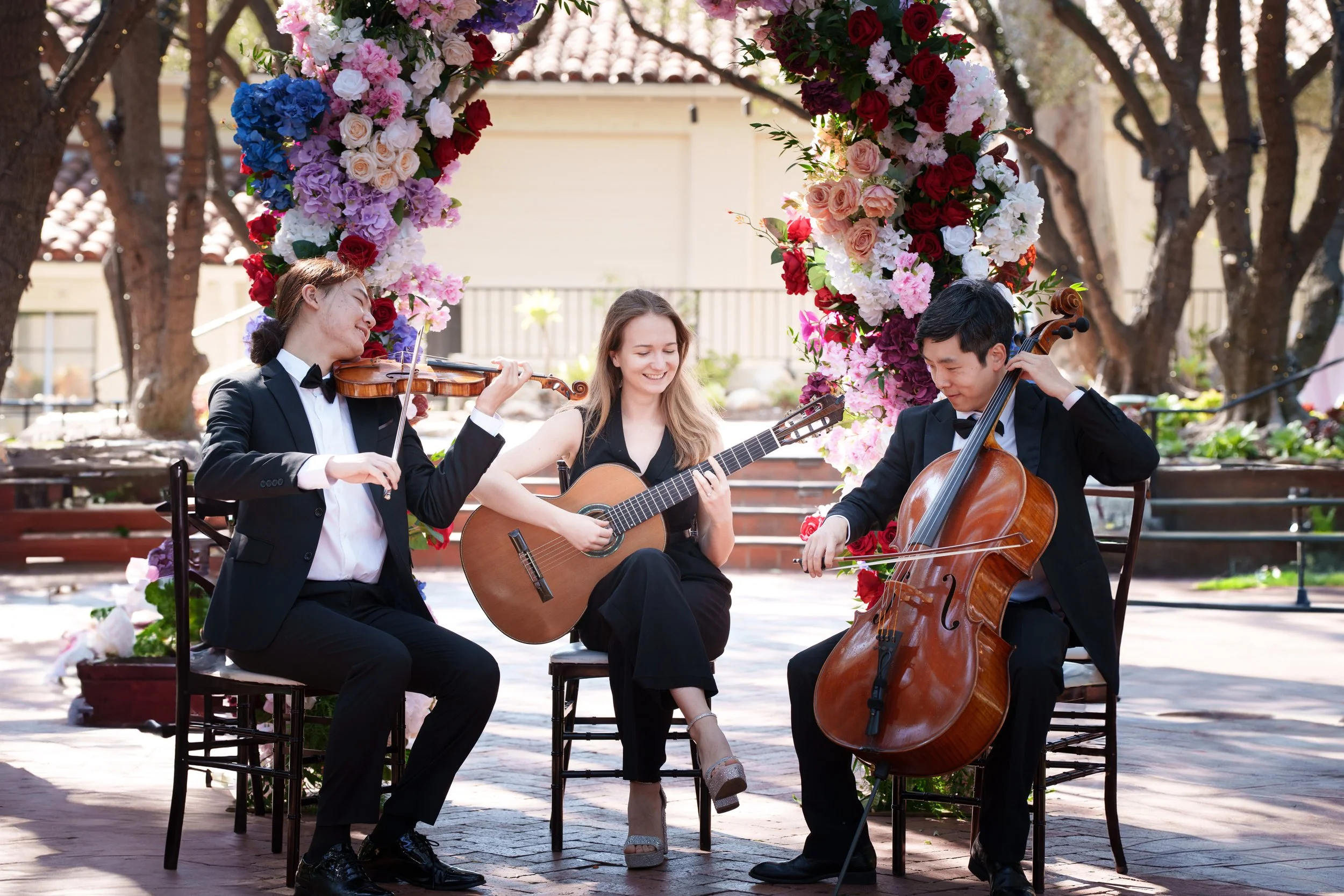 Pink Mozart guitar, violin and cello trio at Padua Hills Theatre in Claremont