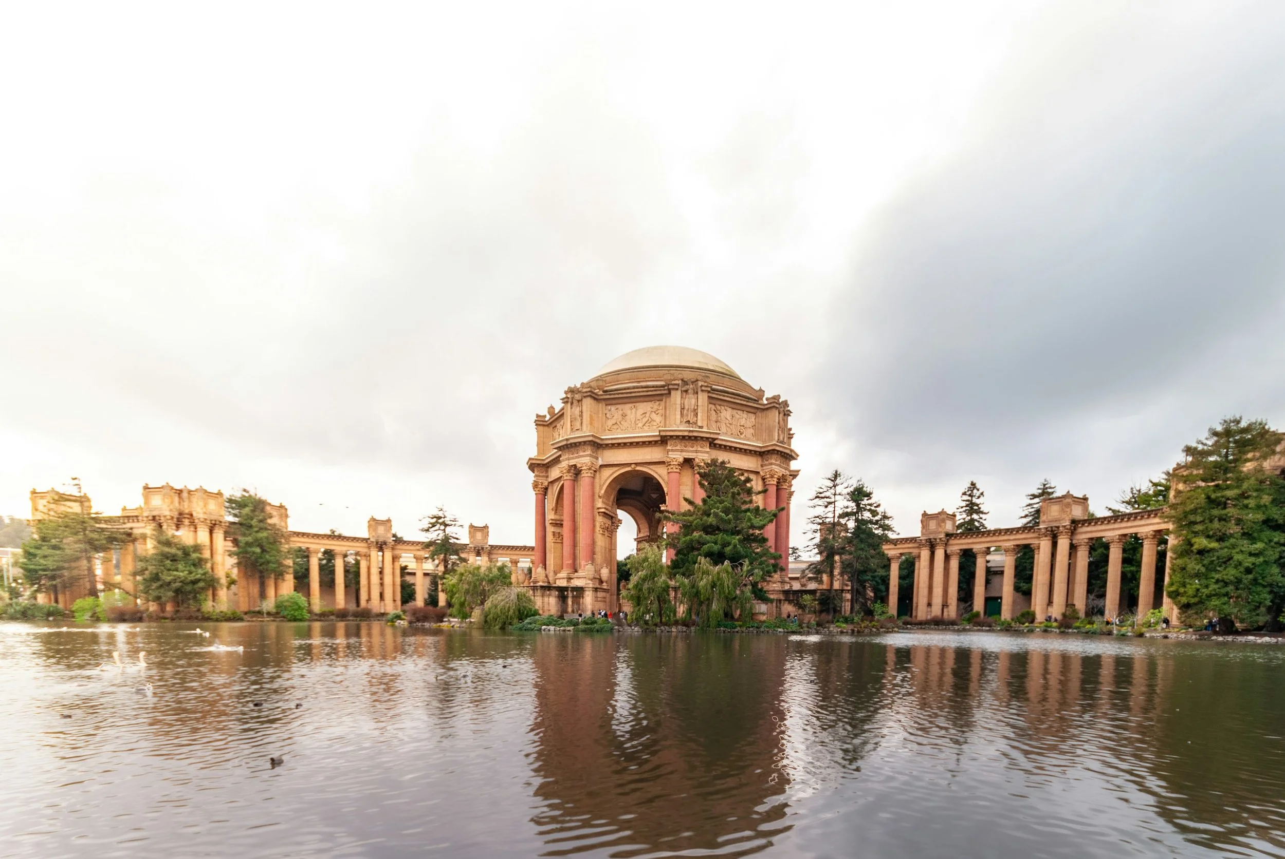 Palace of Fine Arts rotunda and colonnades reflected in the lagoon in San Francisco