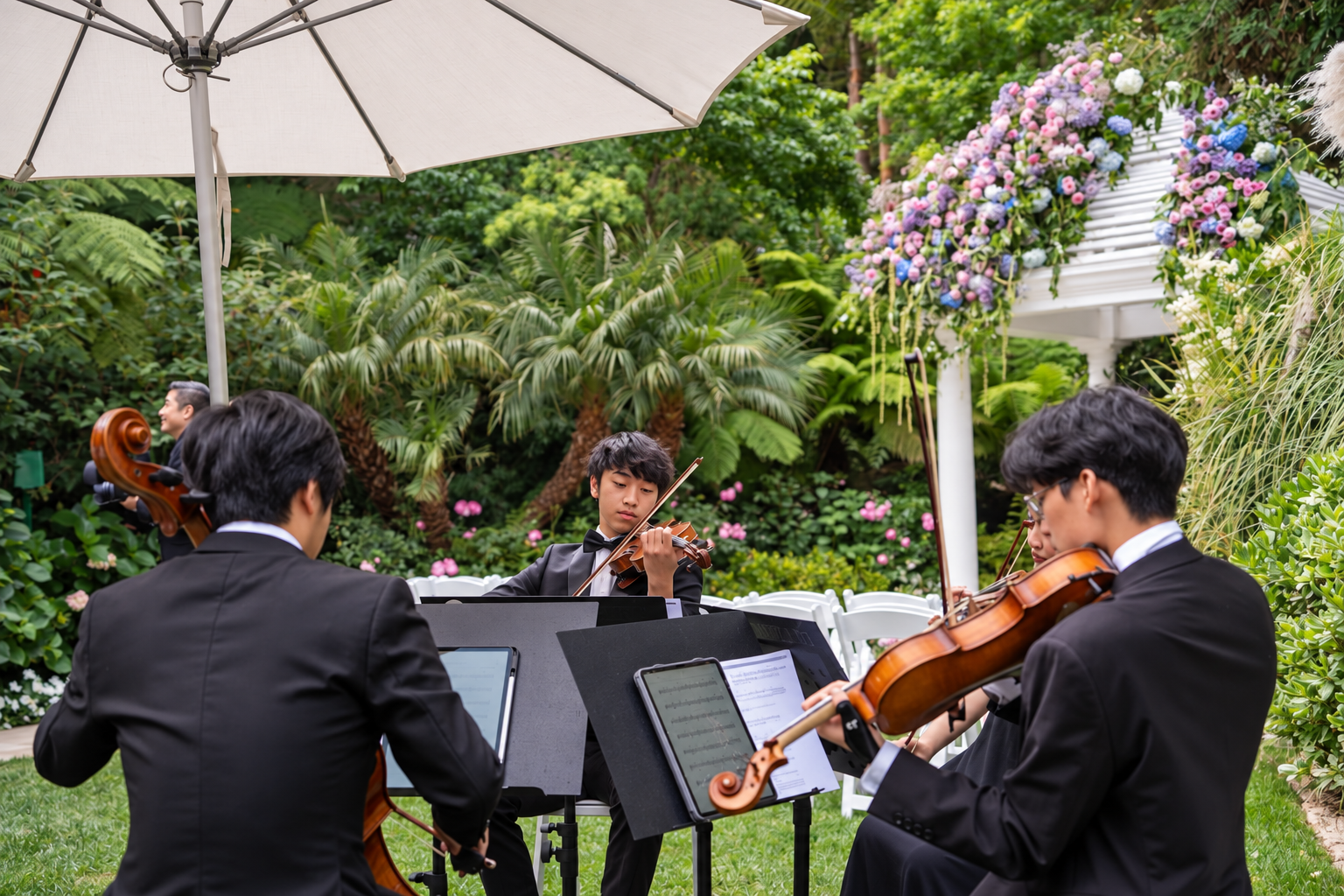 Pink Mozart string quartet performing at an outdoor wedding at Hotel Bel-Air in Los Angeles