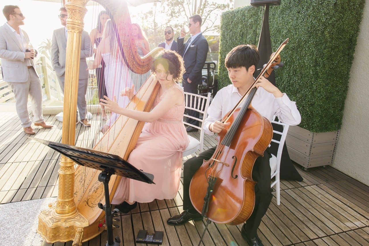 Pink Mozart harp and cello duo performing at L’Auberge Del Mar in San Diego County
