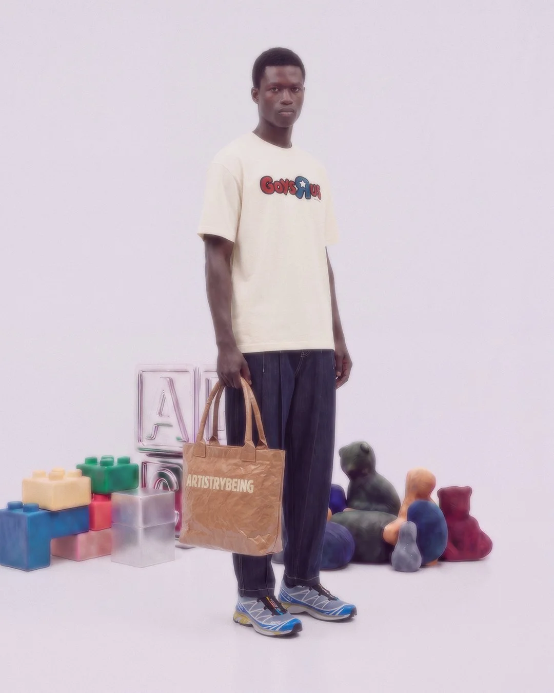 Male model carrying Brown Tote Bag by Artistrybeing