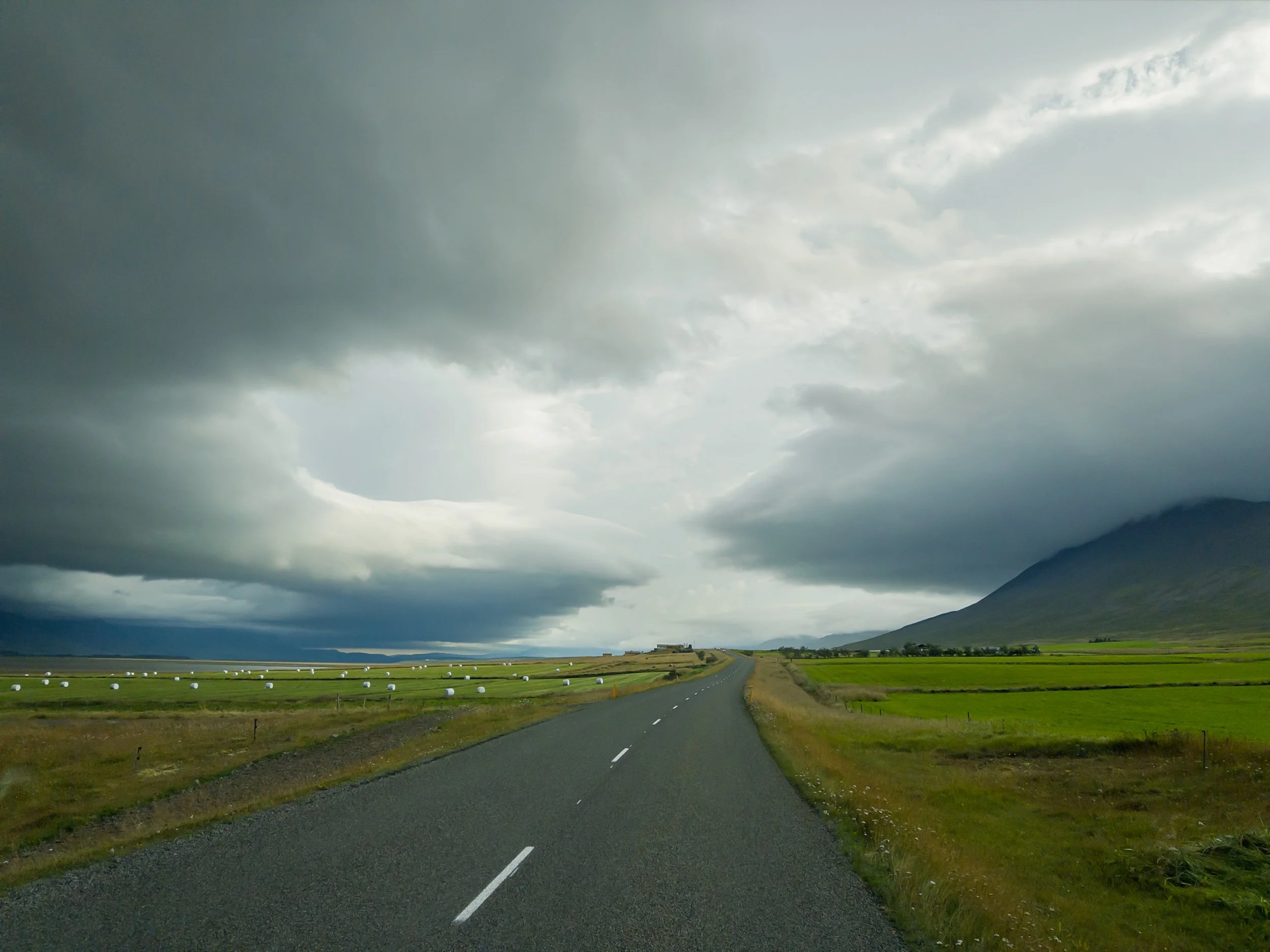 Two storm fronts colliding above Hwy 75 farmlands