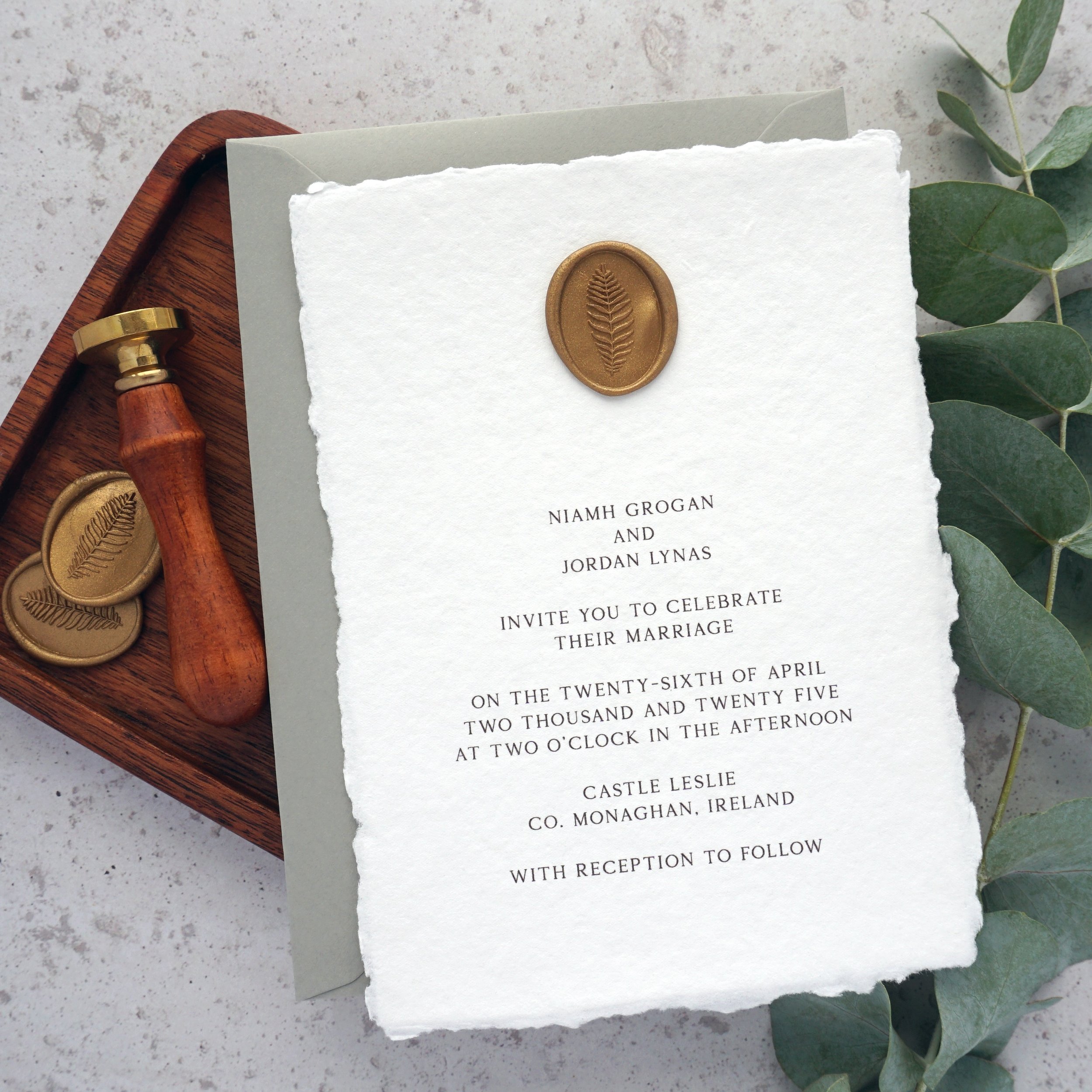 NIAMH - Printed on delicate handmade paper and finished with an oval wax seal, the Niamh suite offers stylish simplicity. Seen here with a beautiful sage green envelope, but easily altered to match your colour scheme. Set the tone of your wedding wit