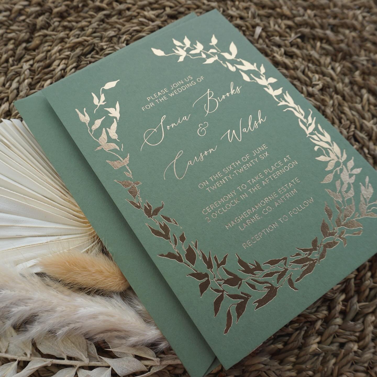 SONIA - Luxury foil pressed wedding invitations crafted on premium olive green cardstock. Featuring delicate gold foliage detailing and a tactile deboss from traditional foil stamping, this timeless suite is perfect for modern couples who want elegan