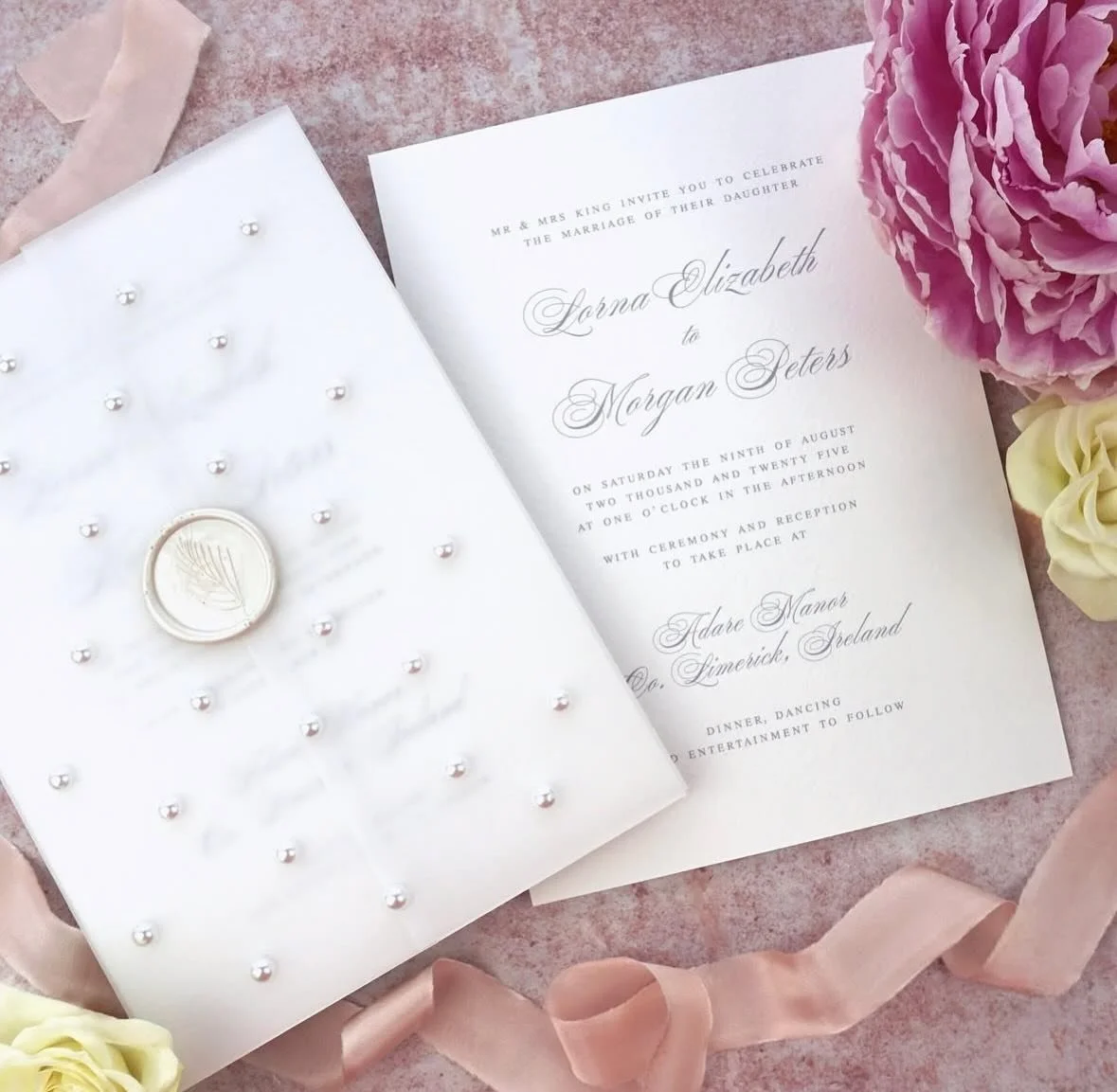 LORNA - A classic invitation with hand embellished vellum jacket covered in pearls, finished with a matching wax seal. Complete the look with one of our premium coloured envelopes, pick any shade to match your colour scheme 
.
.
.
#weddingstationery 