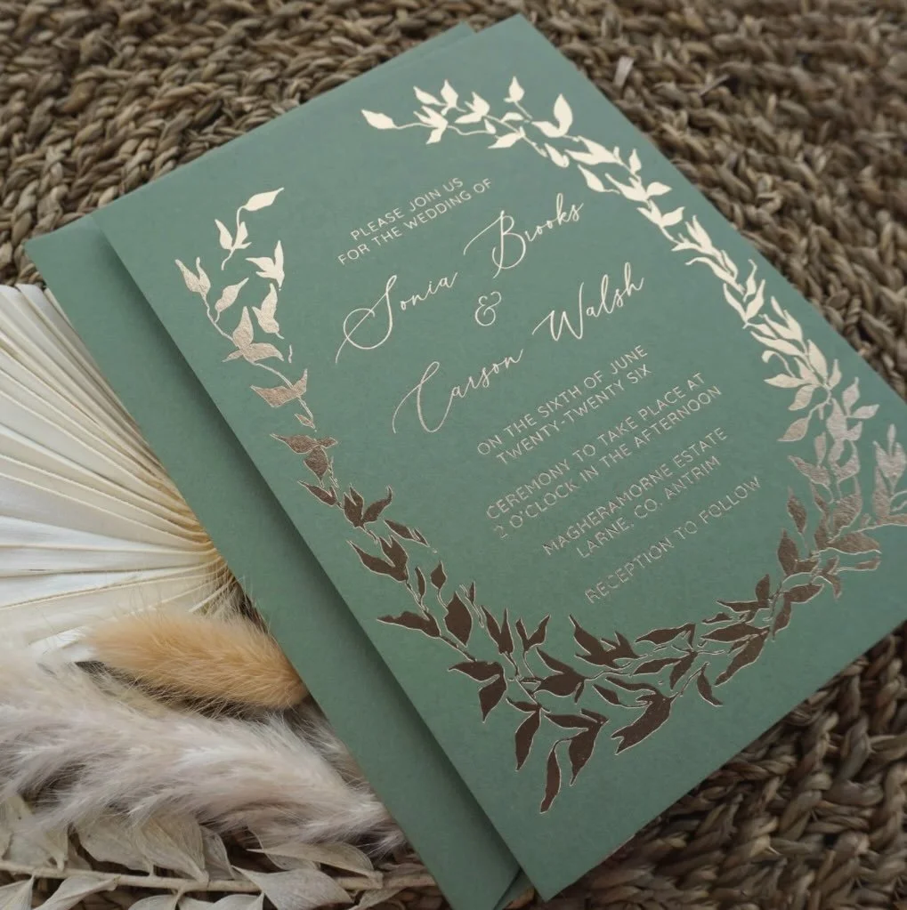 SONIA - Luxury foil pressed wedding invitations crafted on premium olive green cardstock. Featuring delicate gold foliage detailing and a tactile deboss from traditional foil stamping, this timeless suite is perfect for modern couples who want elegan