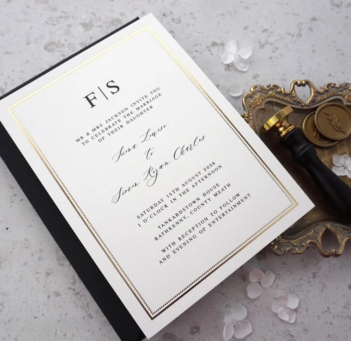 FIONA - This stylish invitation featuring delicate foil pressed boarder, linen cardstock and classic typeface ticks all the boxes when planning a black tie wedding. With black and white colour palettes trending already for 2026 and beyond, this suite