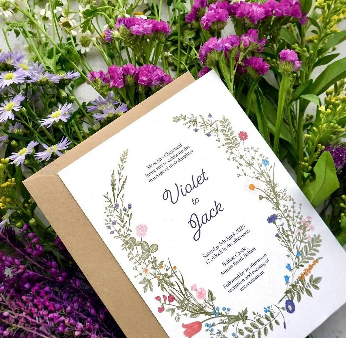 VIOLET - Bring a pop of colour to your wedding day with the beautiful blooms of our Violet suite. Printed on recycled cardstock and paired with a kraft brown envelope, this design is perfect for nature-loving and eco-conscious couples alike. All card