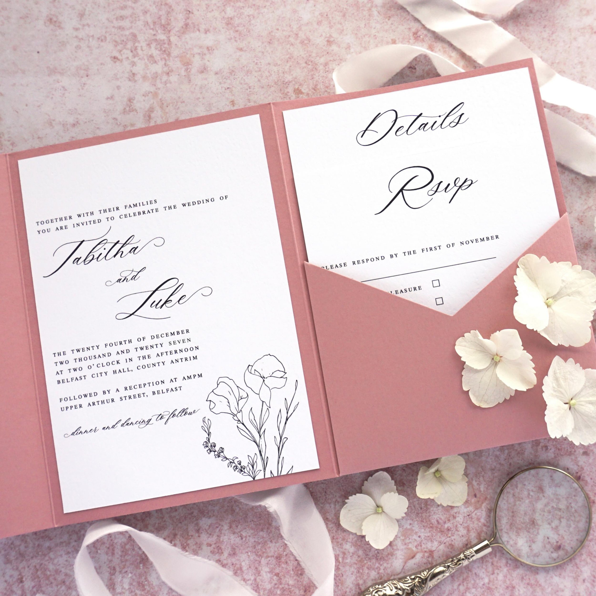 TABITHA - Fall in love with this simplistic floral suite. Complete with invitation, details and RSVP cards all held inside a beautiful dusty rose pocketfold, it&rsquo;s perfect for a romantic wedding. Consider adding some organic silk ribbon to keep 