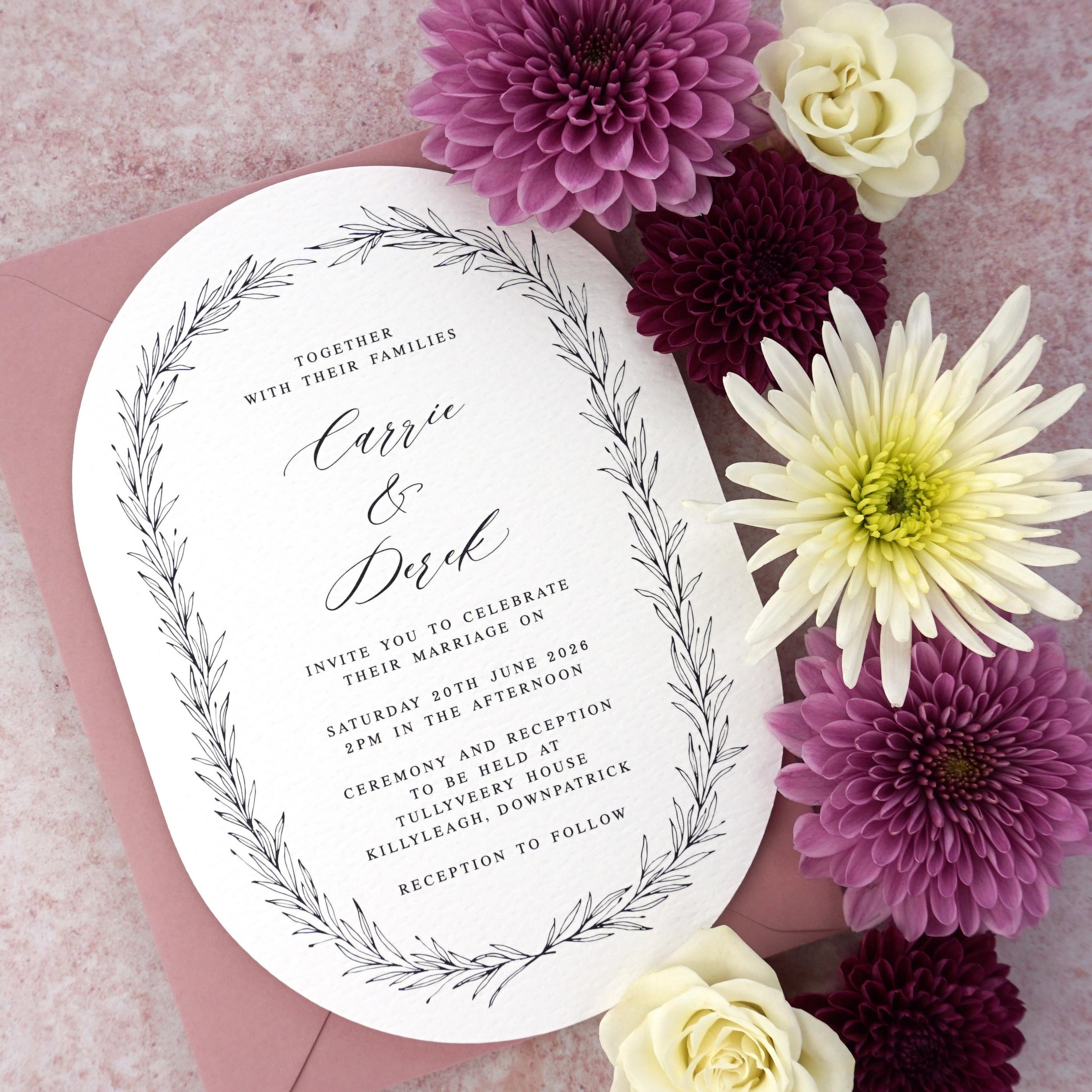 CARRIE - This double arched shape adds a playful touch to this minimalist invitation. Printed on highly textured cardstock, the shape and texture combination makes for a tactile experience. Paired here with a luxury dusty pink envelope, but feel free