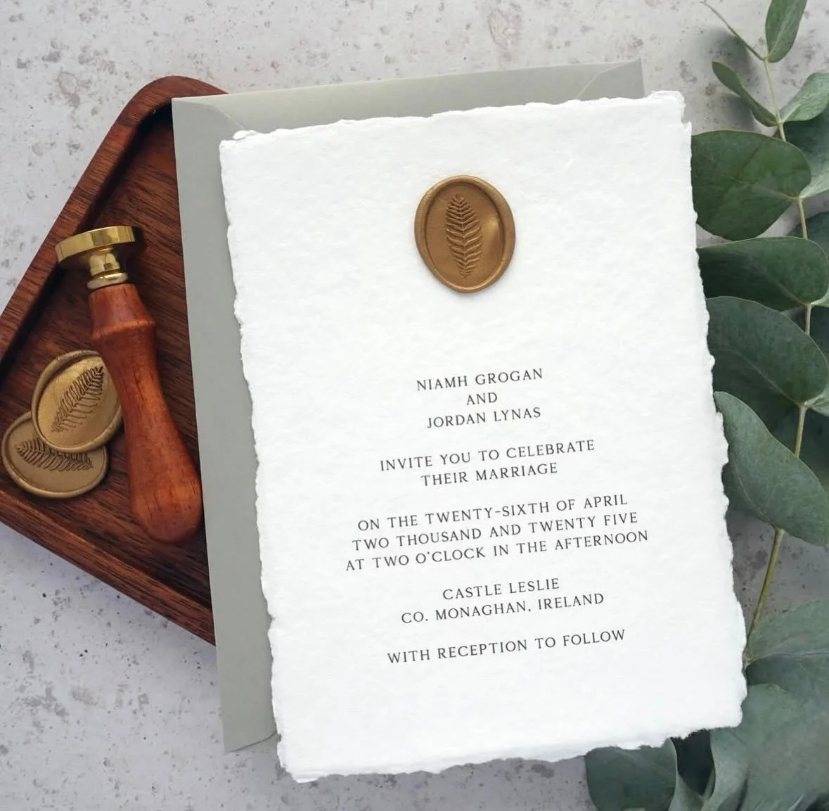 NIAMH - Printed on delicate handmade paper and finished with an oval wax seal, the Niamh suite screams sophistication. Seen here with a beautiful sage green envelope, but easily altered to match your colour scheme. Set the tone of your wedding with b