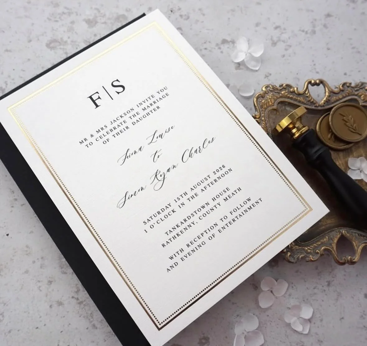FIONA - This stylish invitation featuring delicate foil pressed boarder, linen cardstock and classic typeface ticks all the boxes when planning a black tie wedding. With black and white colour palettes trending already for 2026 and beyond, this suite