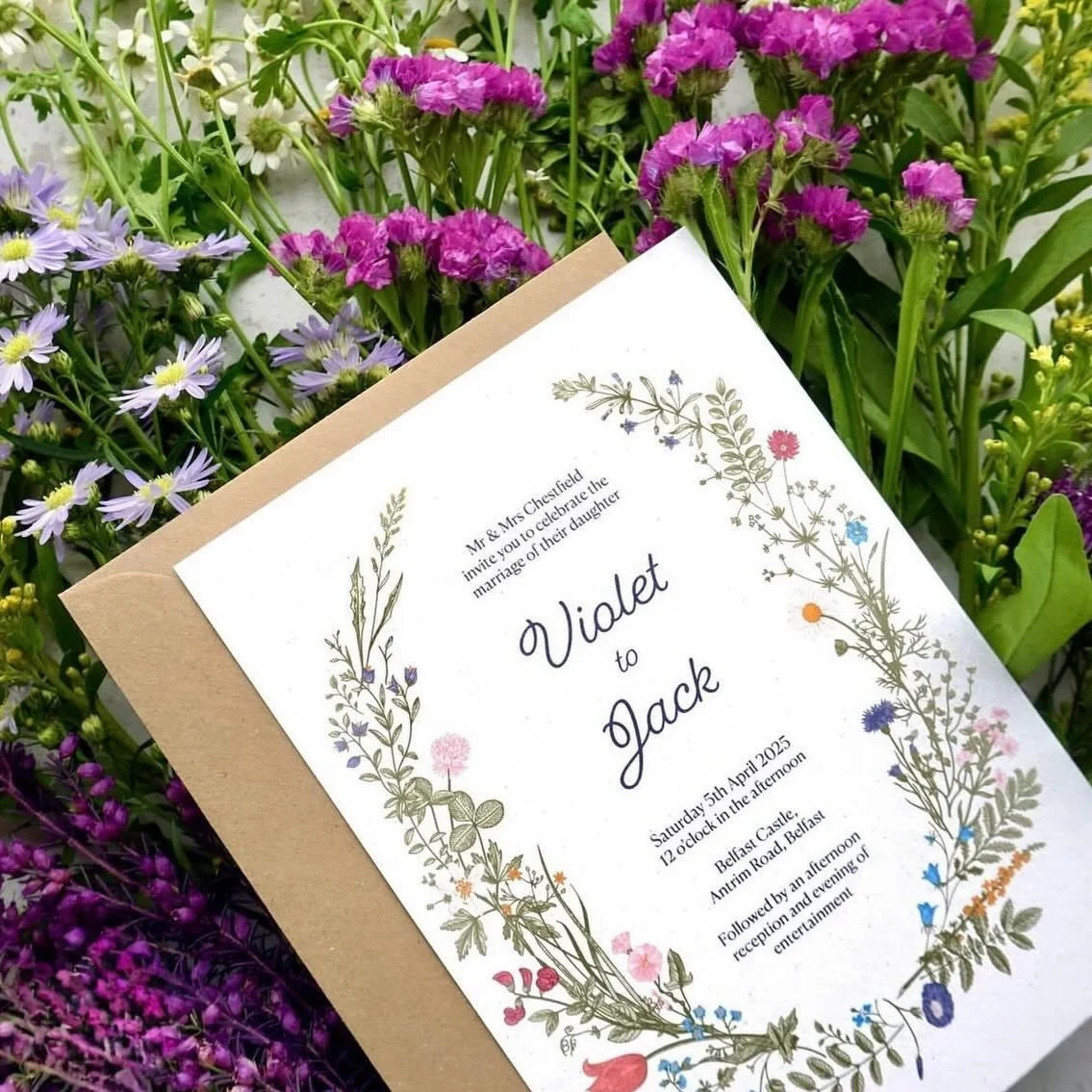 VIOLET - Bring a pop of colour to your wedding day with the beautiful blooms of our Violet suite. Printed on recycled cardstock and paired with a kraft brown envelope, this design is perfect for nature-loving and eco-conscious couples alike. All card