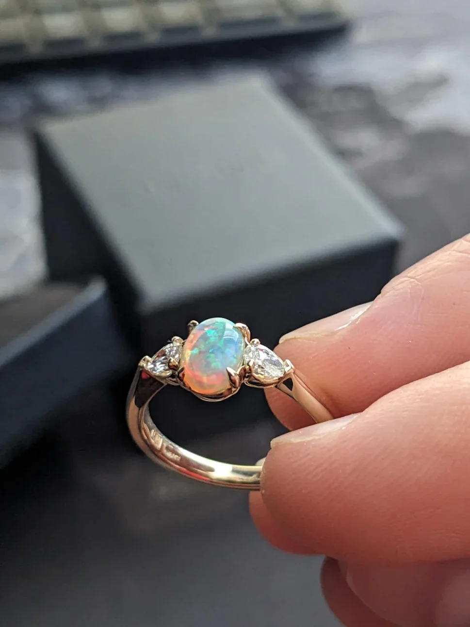 Opan and diamond trilogy engagement ring