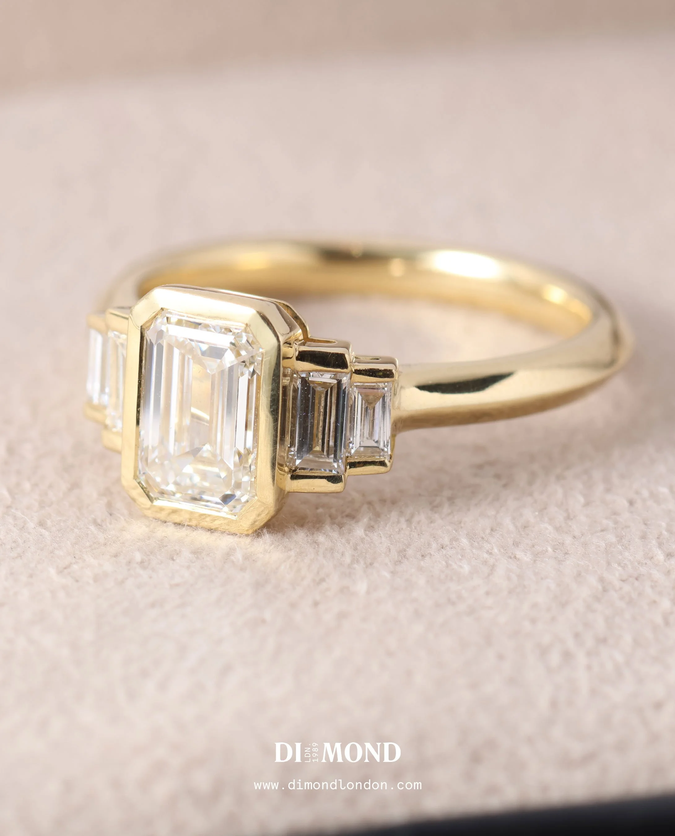 Five stone bezel set engagement ring.