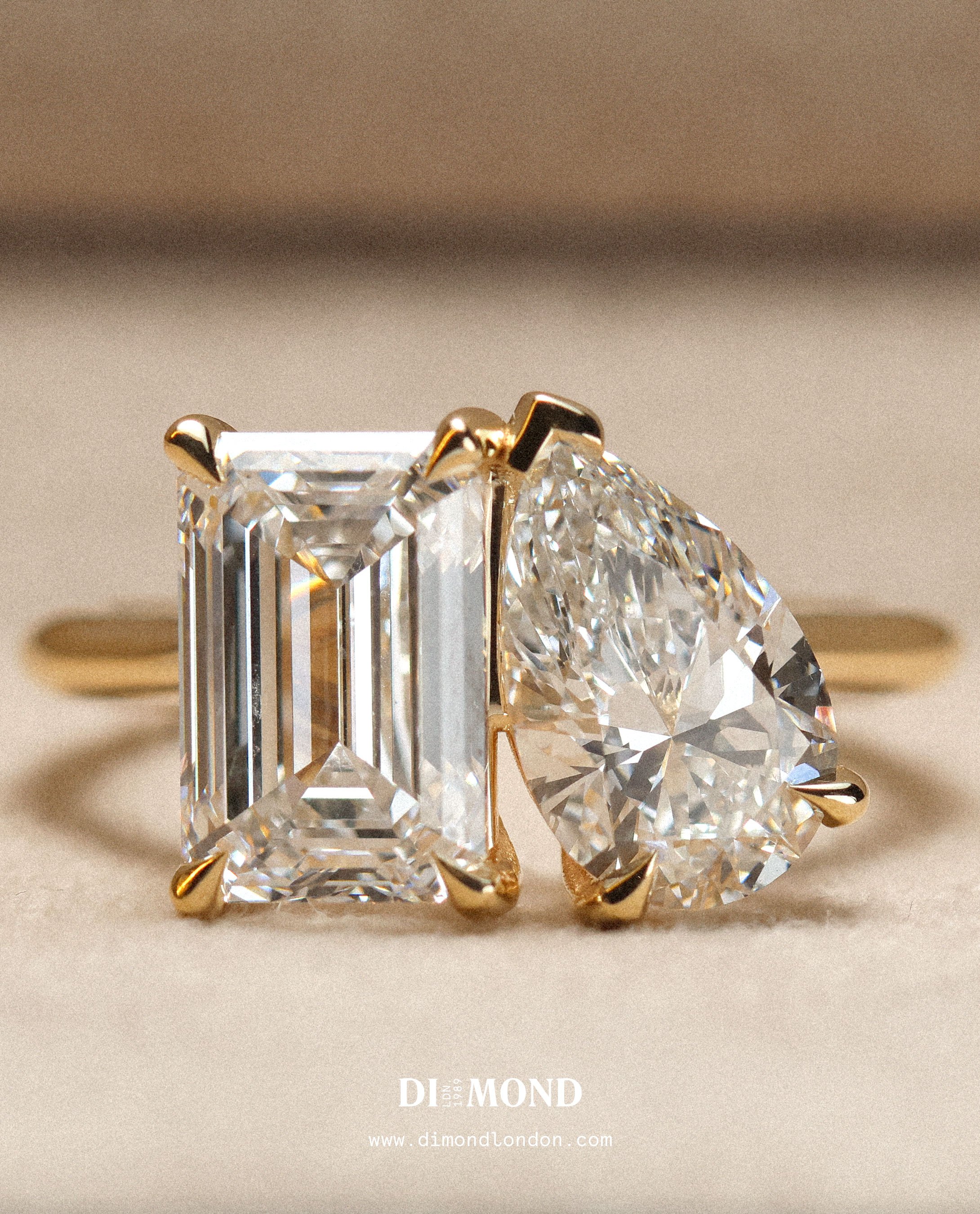Emerald cut diamond and pear cut diamond toi et moi engagement ring