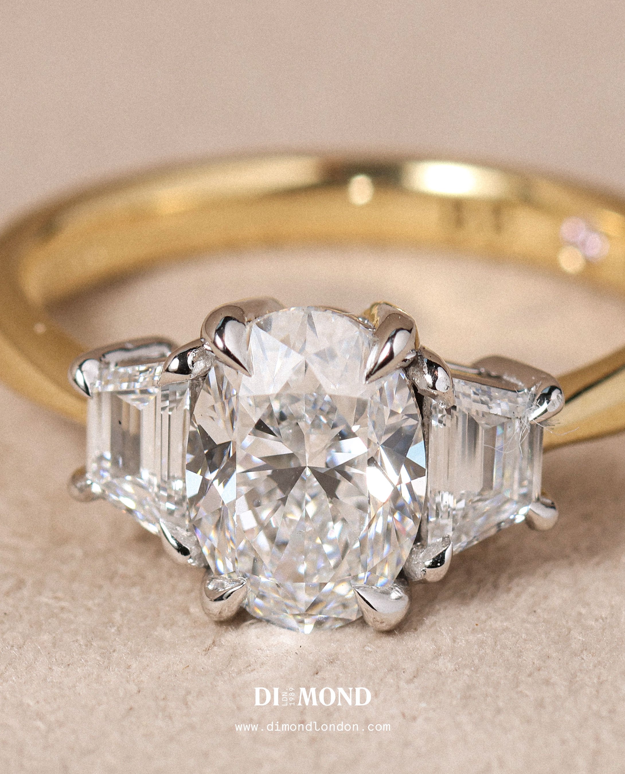 Vintage inspired oval diamond trilogy engagement ring.