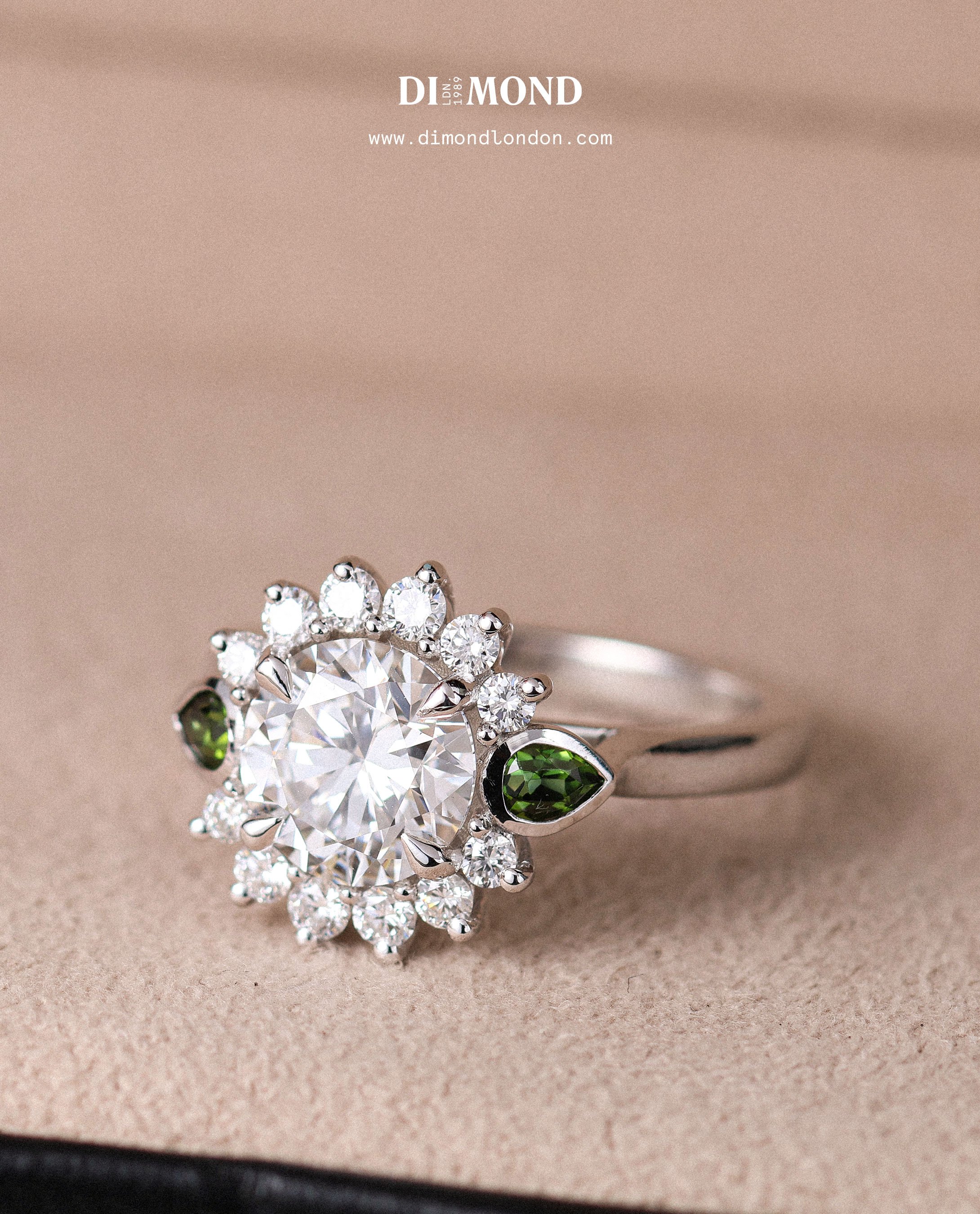 Large round diamond with white and green diamond halo