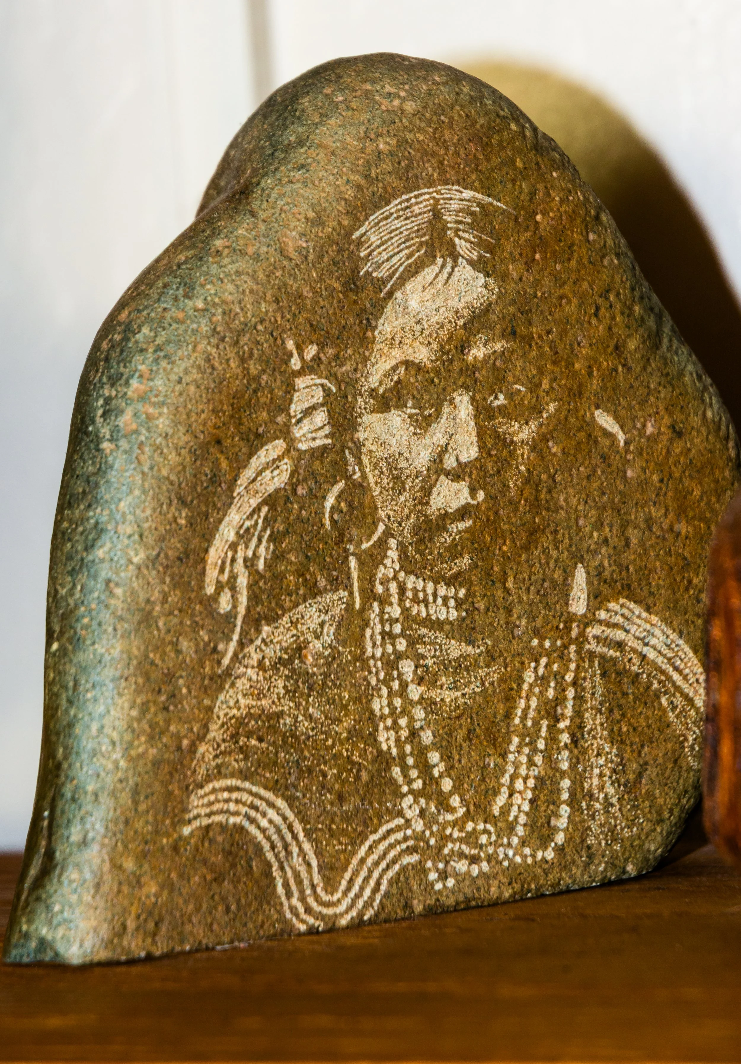 Etched stone image of a Native American girl, belonged to my parents.