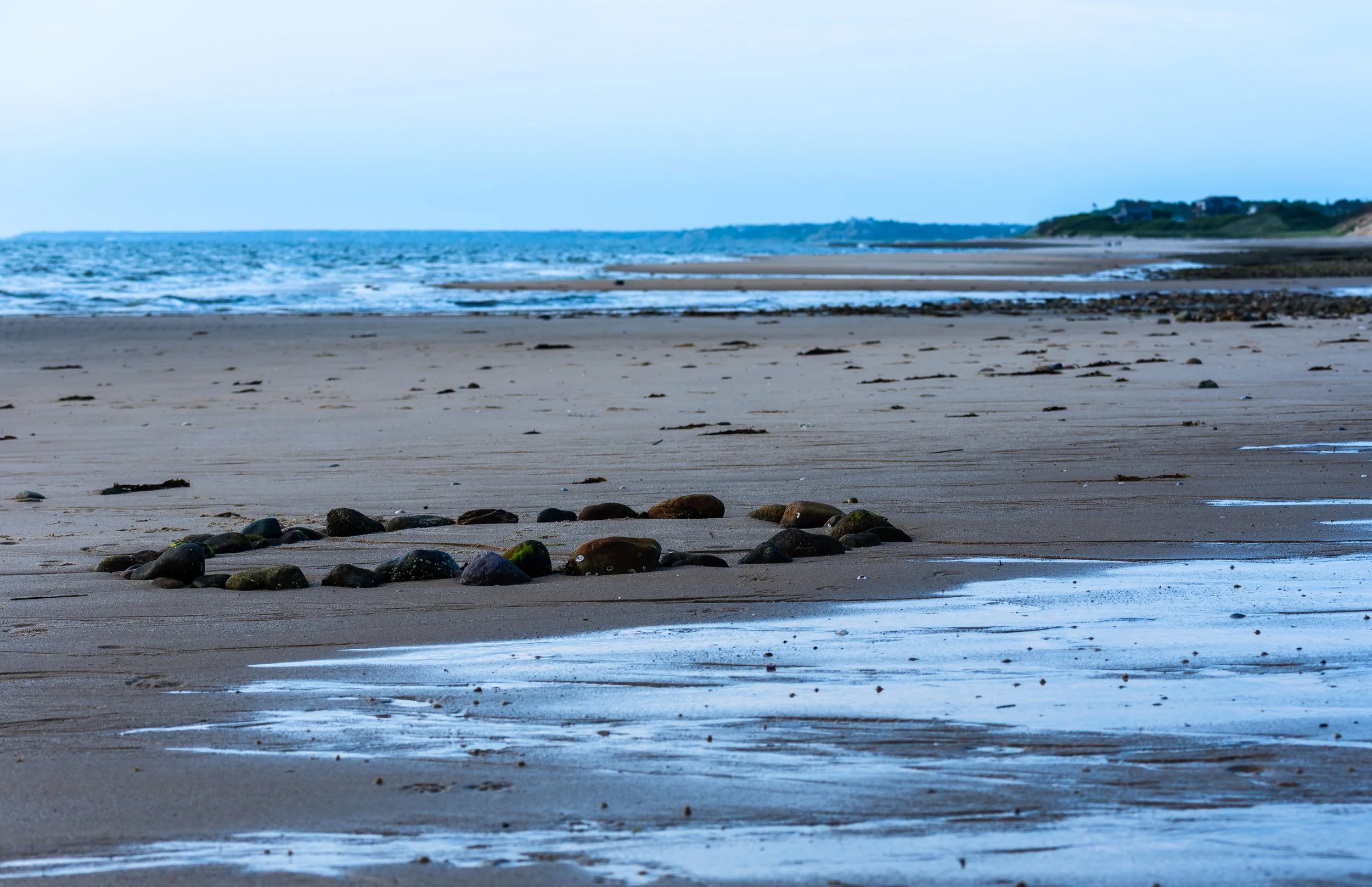 Cape Cod Beach in with rocks in a circle