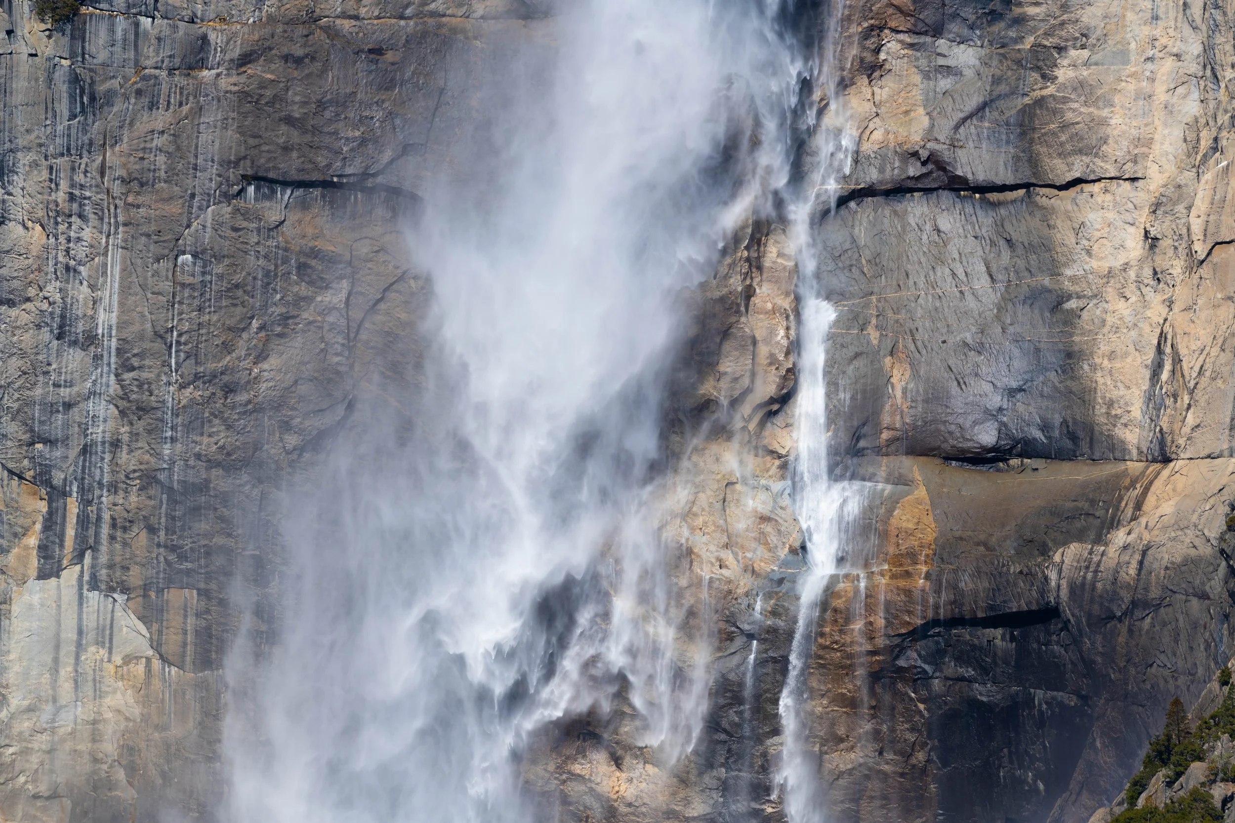 closeup of Yosemite Falls against the rugged cliffs