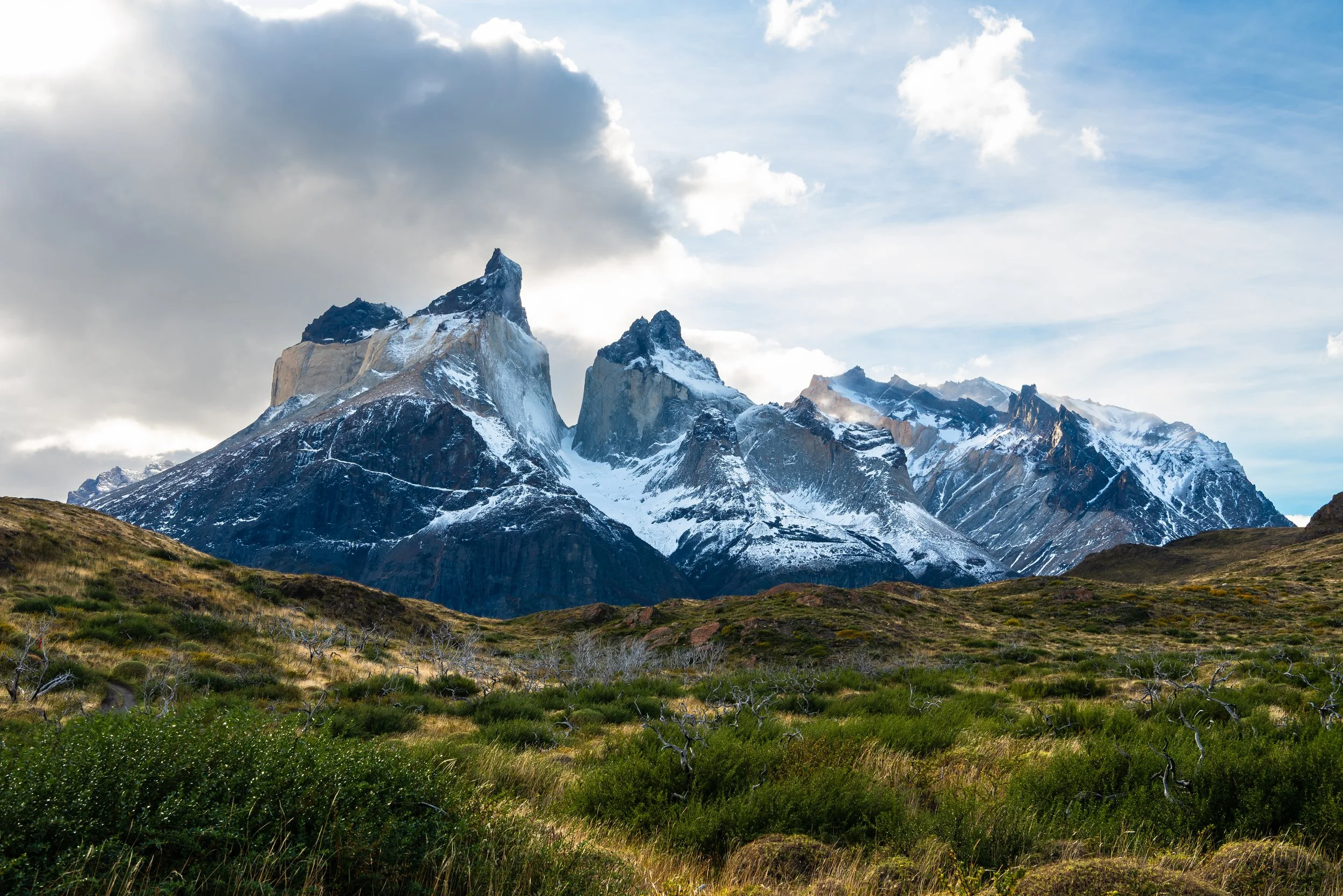 Torres Del Paine on hike with lighter, green foreground
