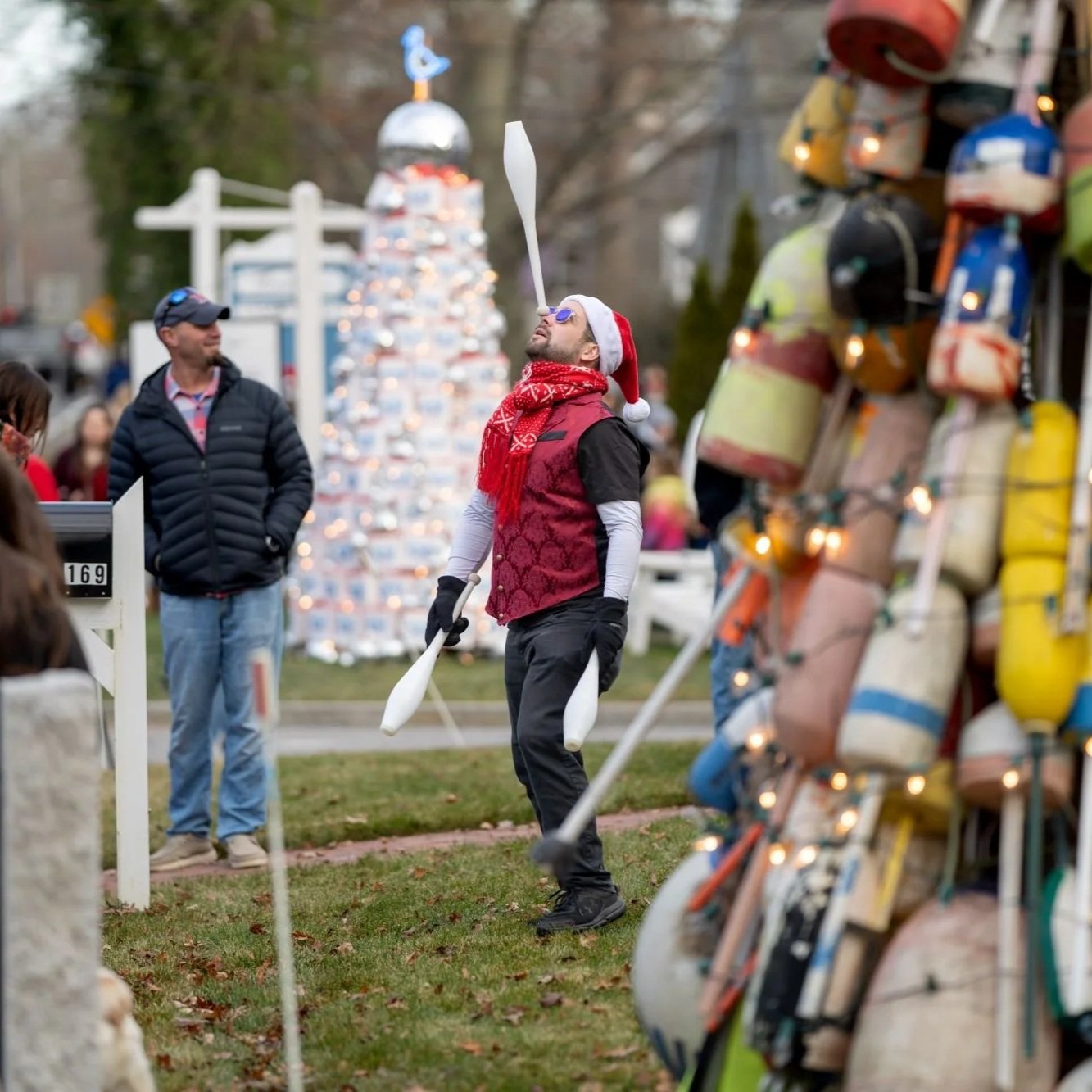 A juggler juggling at a holiday festival in Yarmouth MA