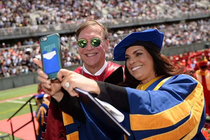 Soledad O'Brien taking a selfie at a graduation