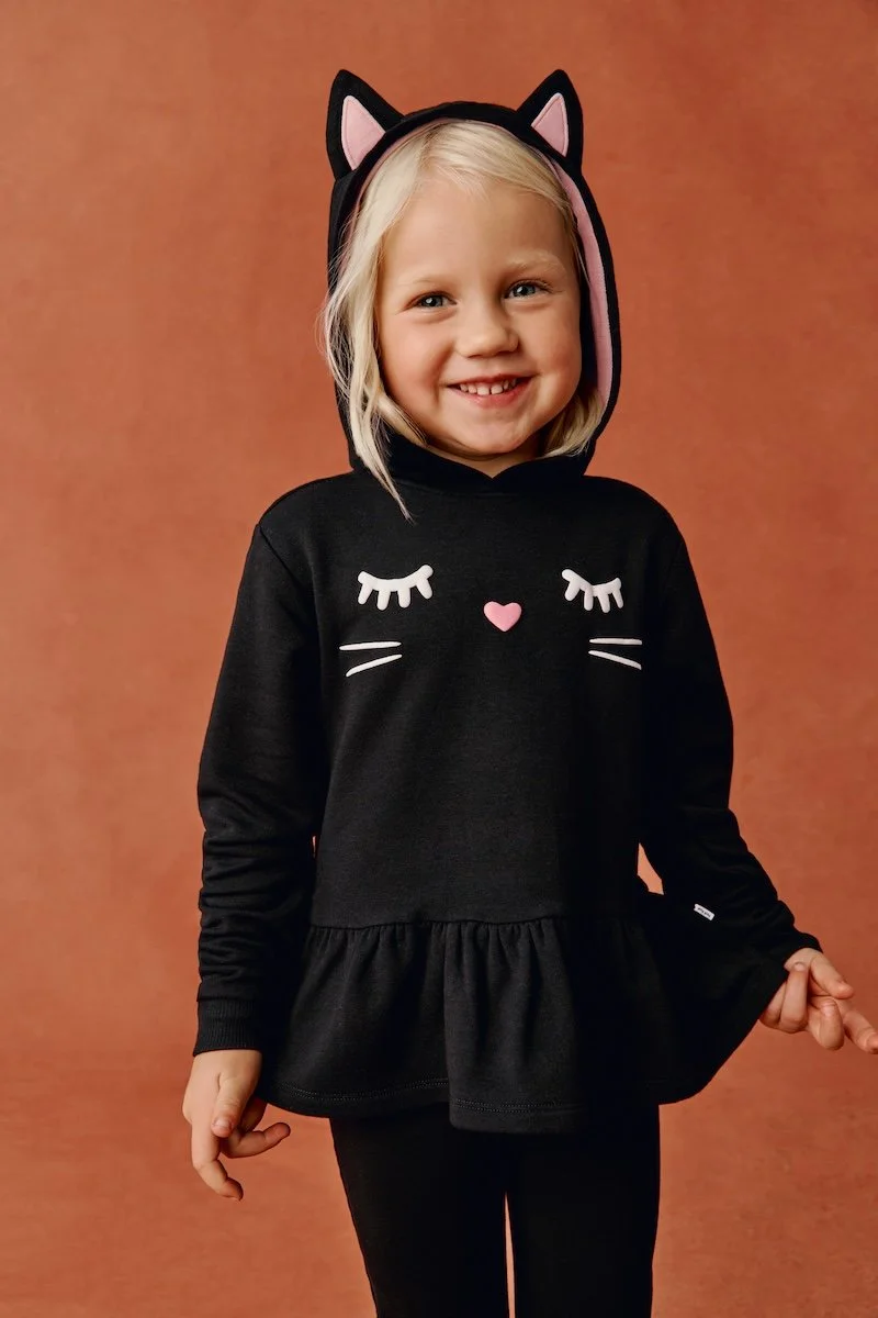 4-year-old model in a kitty peplum hoodie from Little Sleepies. 