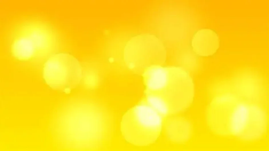 Yellow bokeh background with circular light spots.