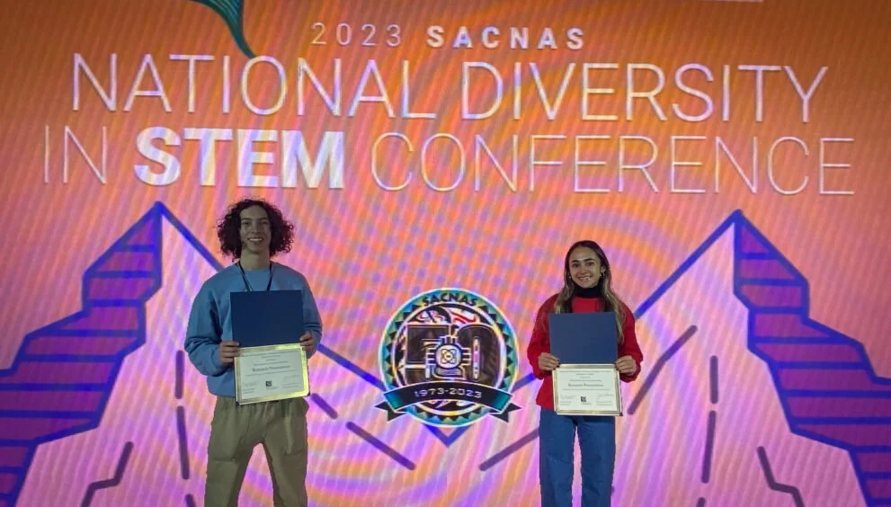  Benjamin Awad and Keyara Piri receive the 2023 SACNAS National Diversity in STEM Conference Presentation Award. 
