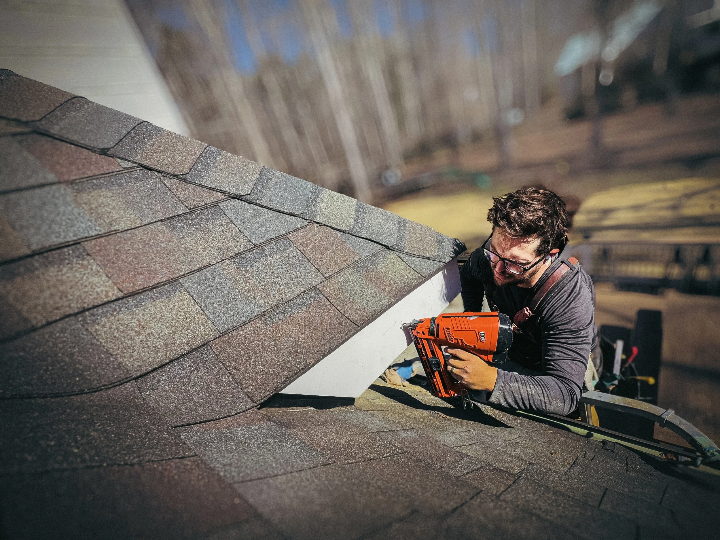 Athens, GA builder installing new fascia board with proper roofline clearance to prevent future wood rot.