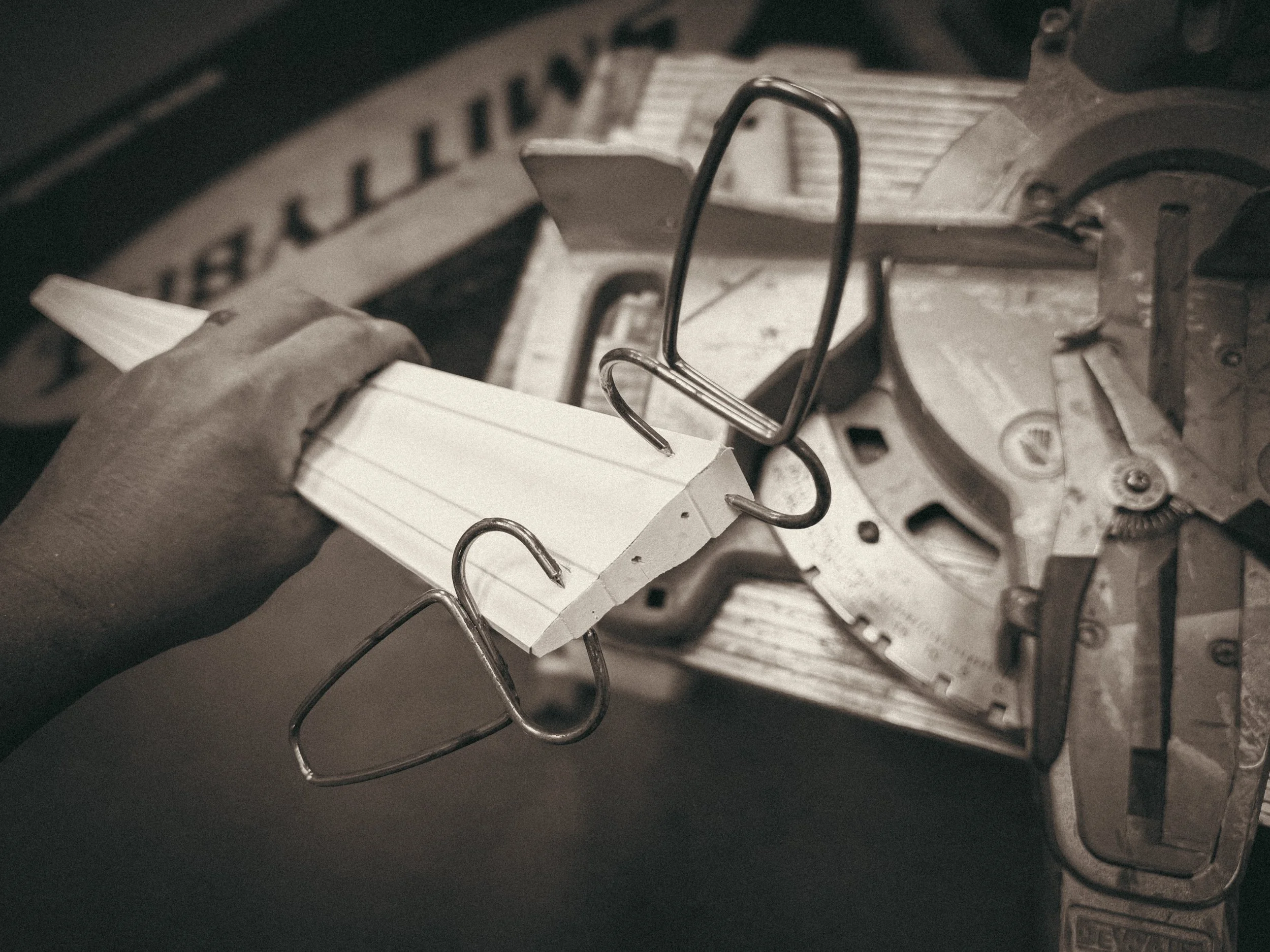 Close up of a window apron return being held together with pinch clamps