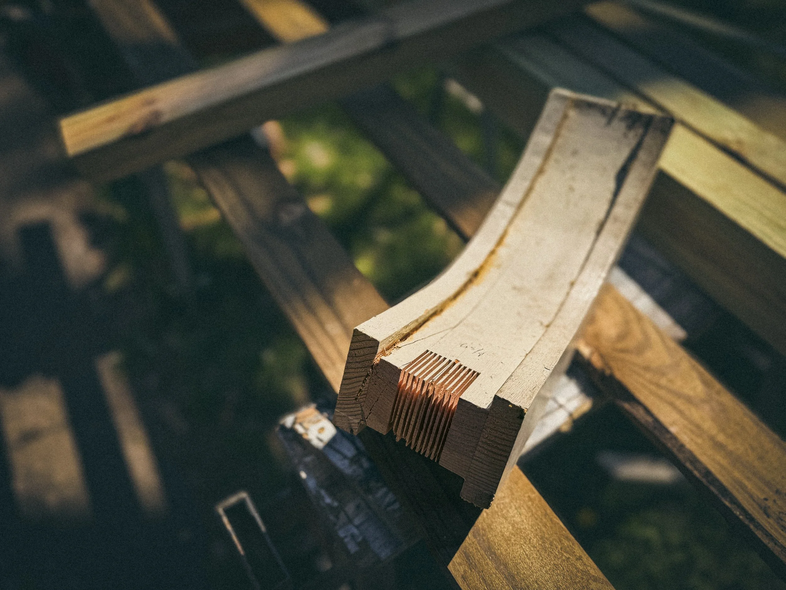Kerf cut mortise in a bent laminated handrail section to accept repair