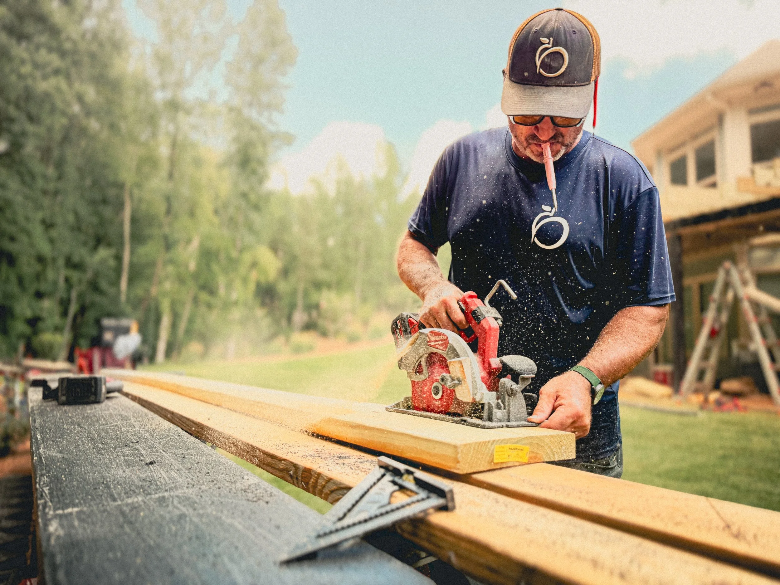 Carpenter from Athens, GA using a circular saw to rip a joist