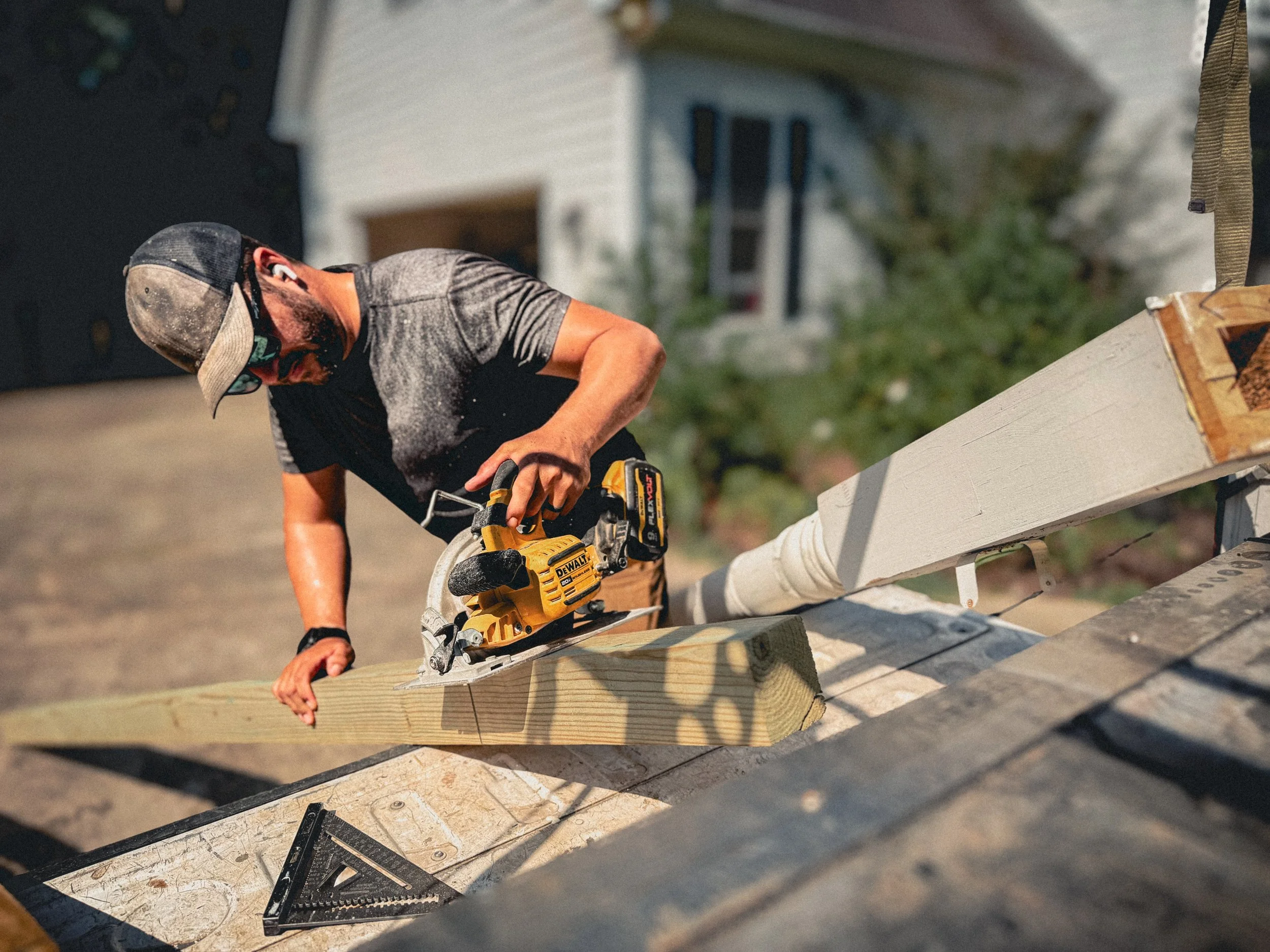 Carpenter using a circular saw to cut a temporary post to length for a home repair in Watkinsville, GA