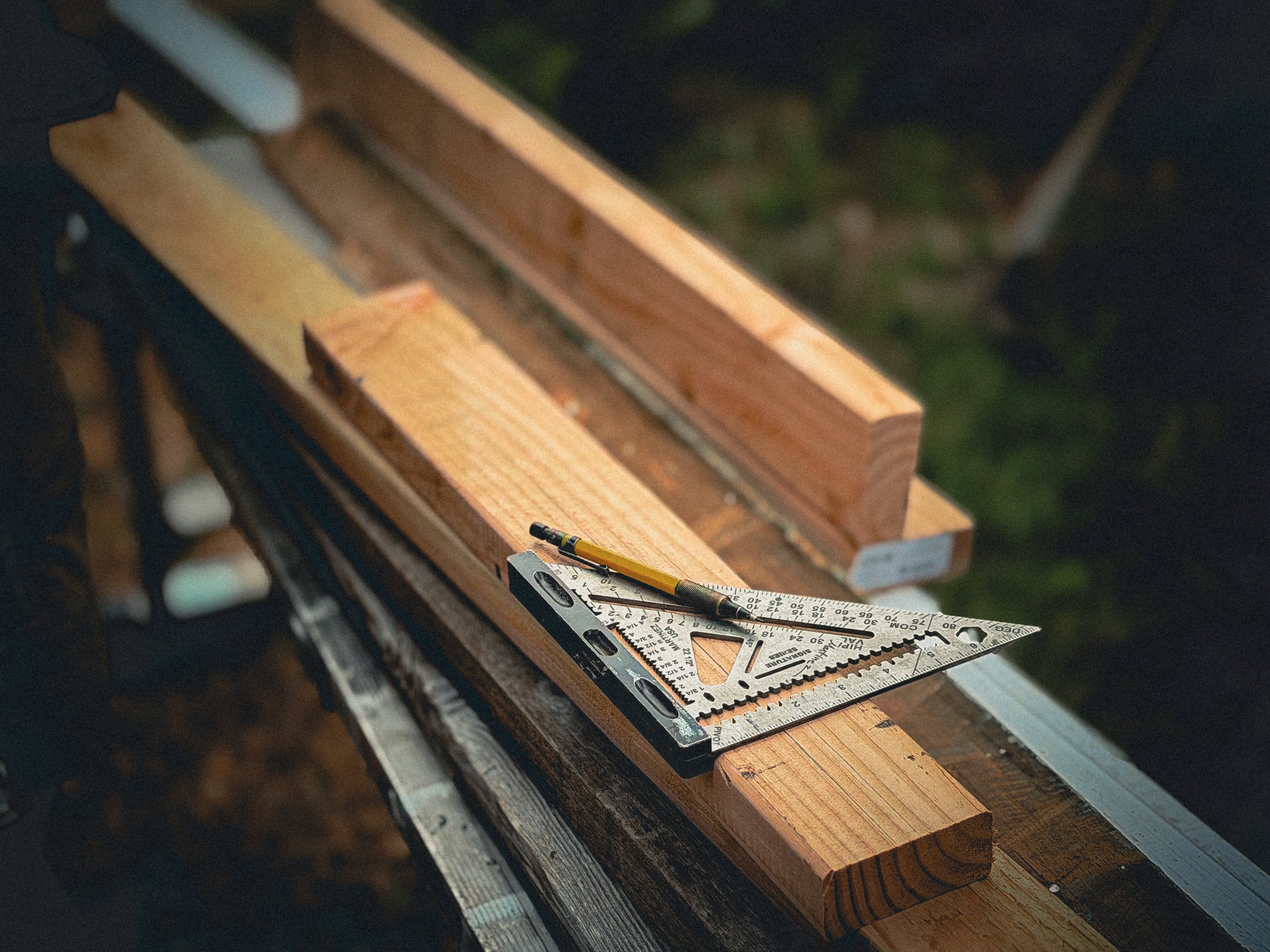 Martinez speed square with a mechanical pencil used for marking lumber layout
