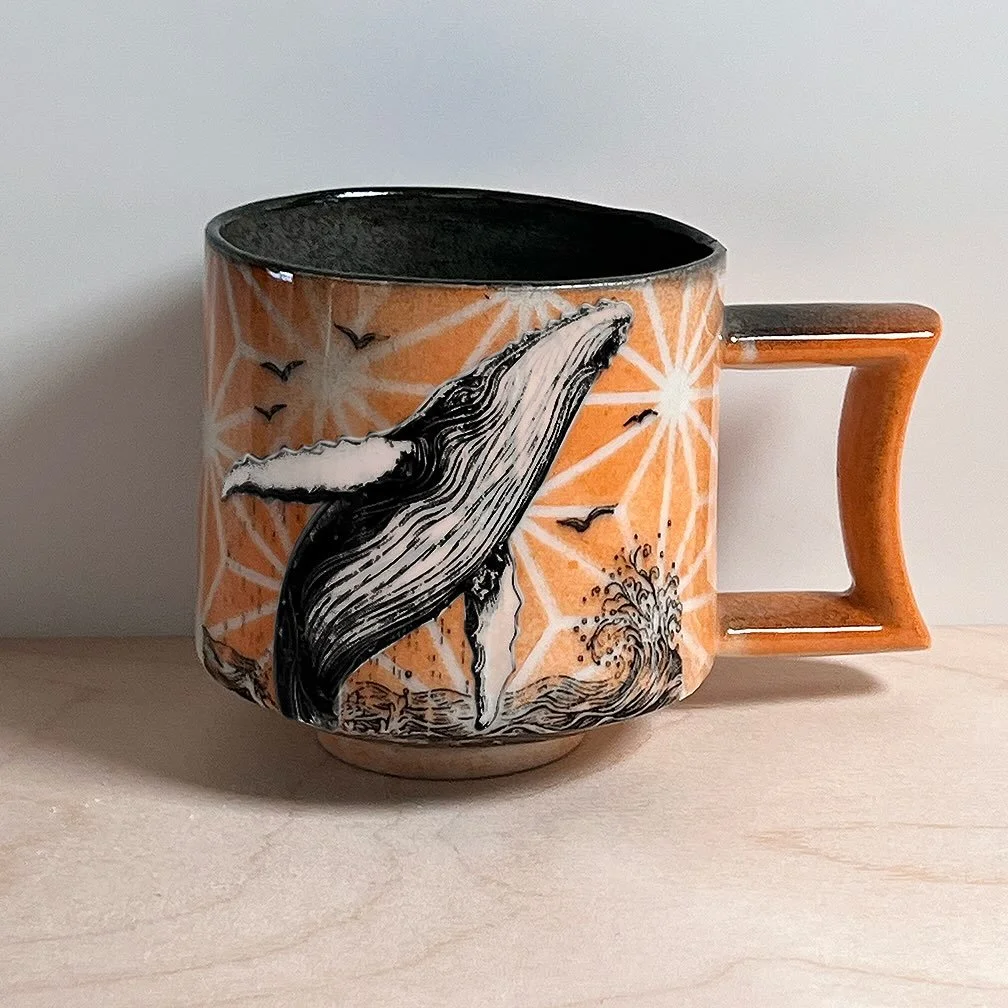 The difference between cutting closely around a transfer and applying it before adding other decoration (the first photo) or doing the decoration first then applying the transfer. In the first case, the transfer acts like a mask and is taken off last