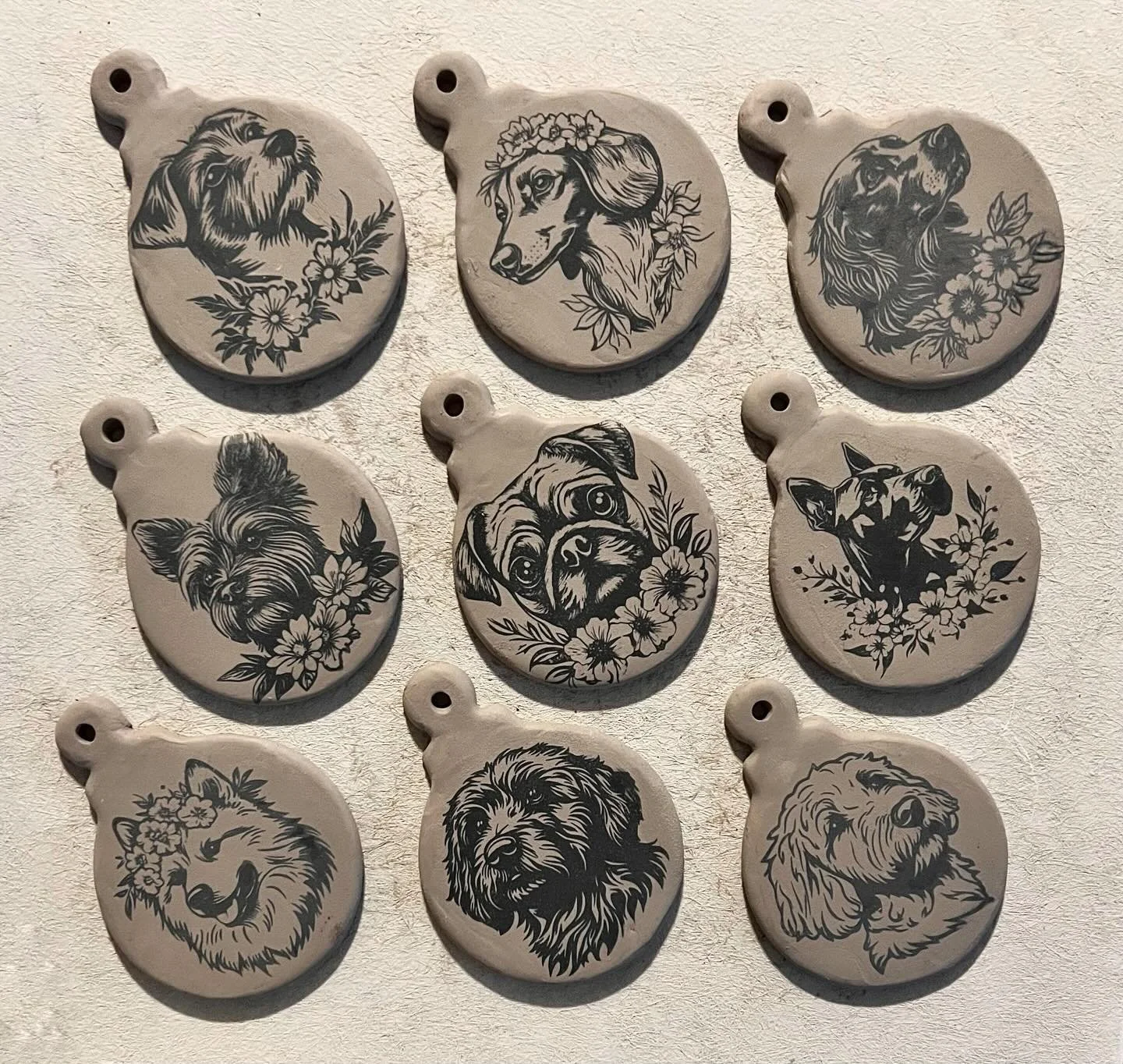 Making doggie ornaments! #underglazetransfers #ceramicornaments