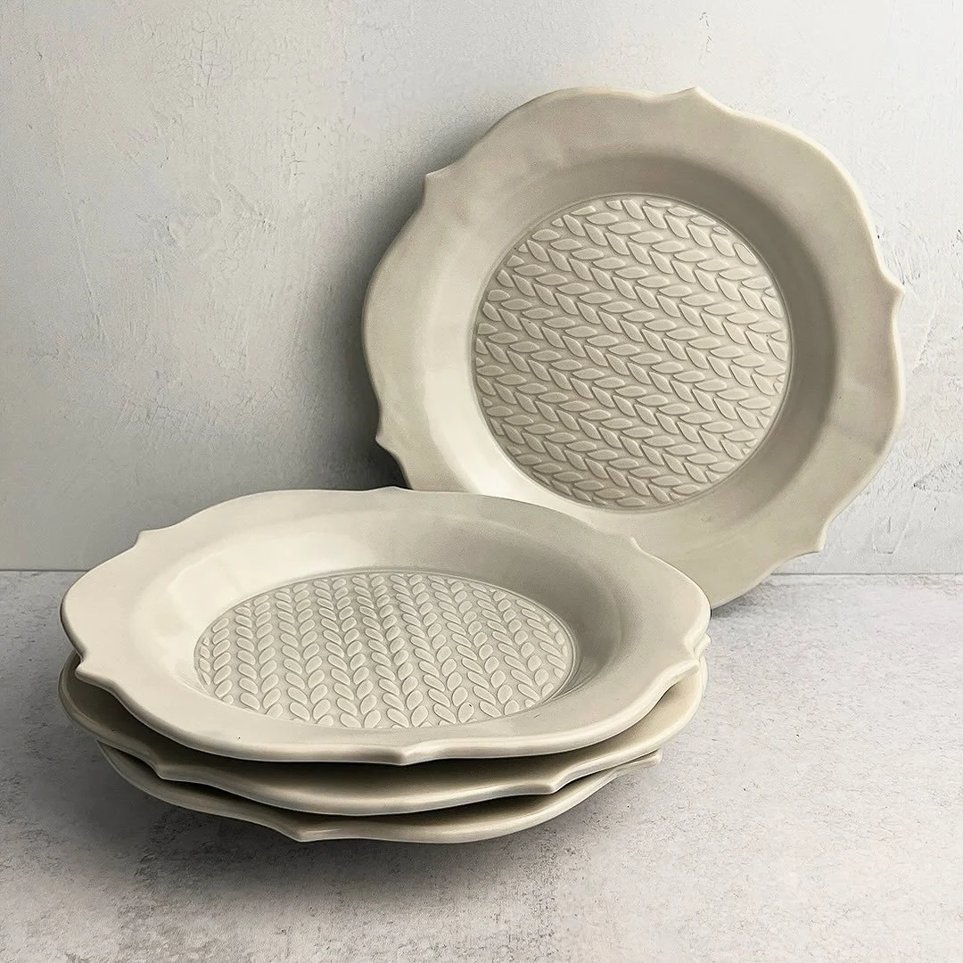 A set of plates using the Stockinette stencil for texture and @gr.pottery.forms. #clay #ceramics #claytexture #stencil #claystencil