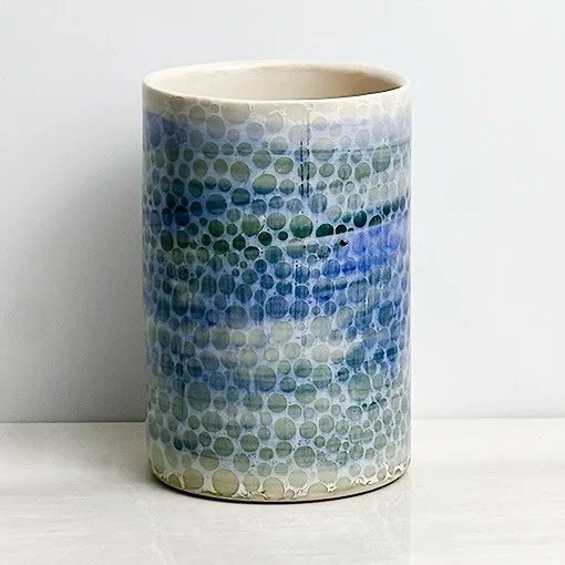 Layers of brushed on blue and green underglaze create the base of this porcelain tumbler or vase, with the white &ldquo;Bubble Texture&rdquo; transfer applied on top for a soft, dimensional finish. I&rsquo;m loving this combo! #ceramics #underglazetr