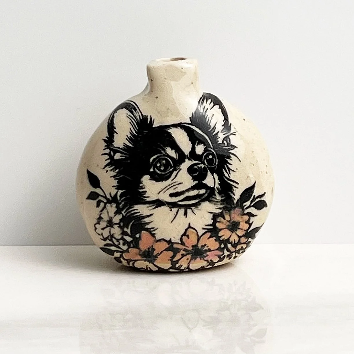 Little vases using the Small Dog Breed Portraits underglaze transfer. I applied the transfers on greenware, bisqued, then added water-downed underglazes the glazed and fired! #dogtransfer #printonclay #underglaze