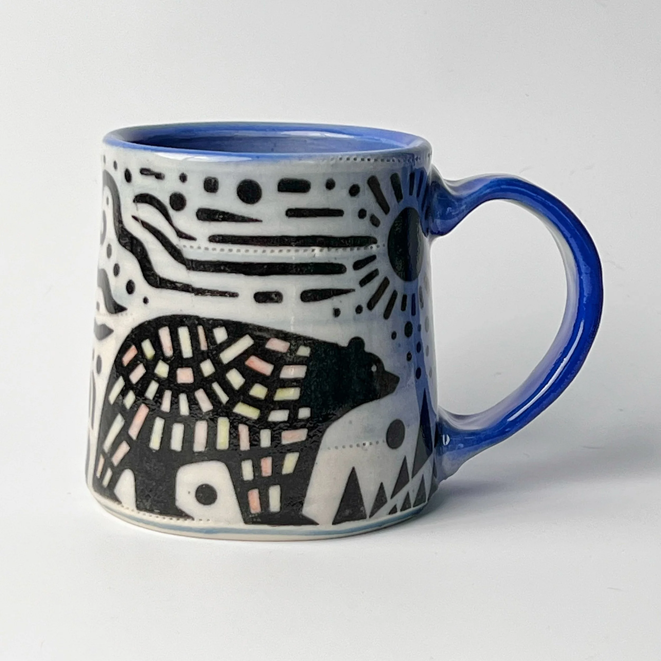 Here&rsquo;s the mug I mentioned the other day. This is the underglaze transfer, &ldquo;Folksy Bears&rdquo;. I applied the transfer when the mug was leather hard, bisqued then added some water downed underglazes in some of the rectangular shapes on t