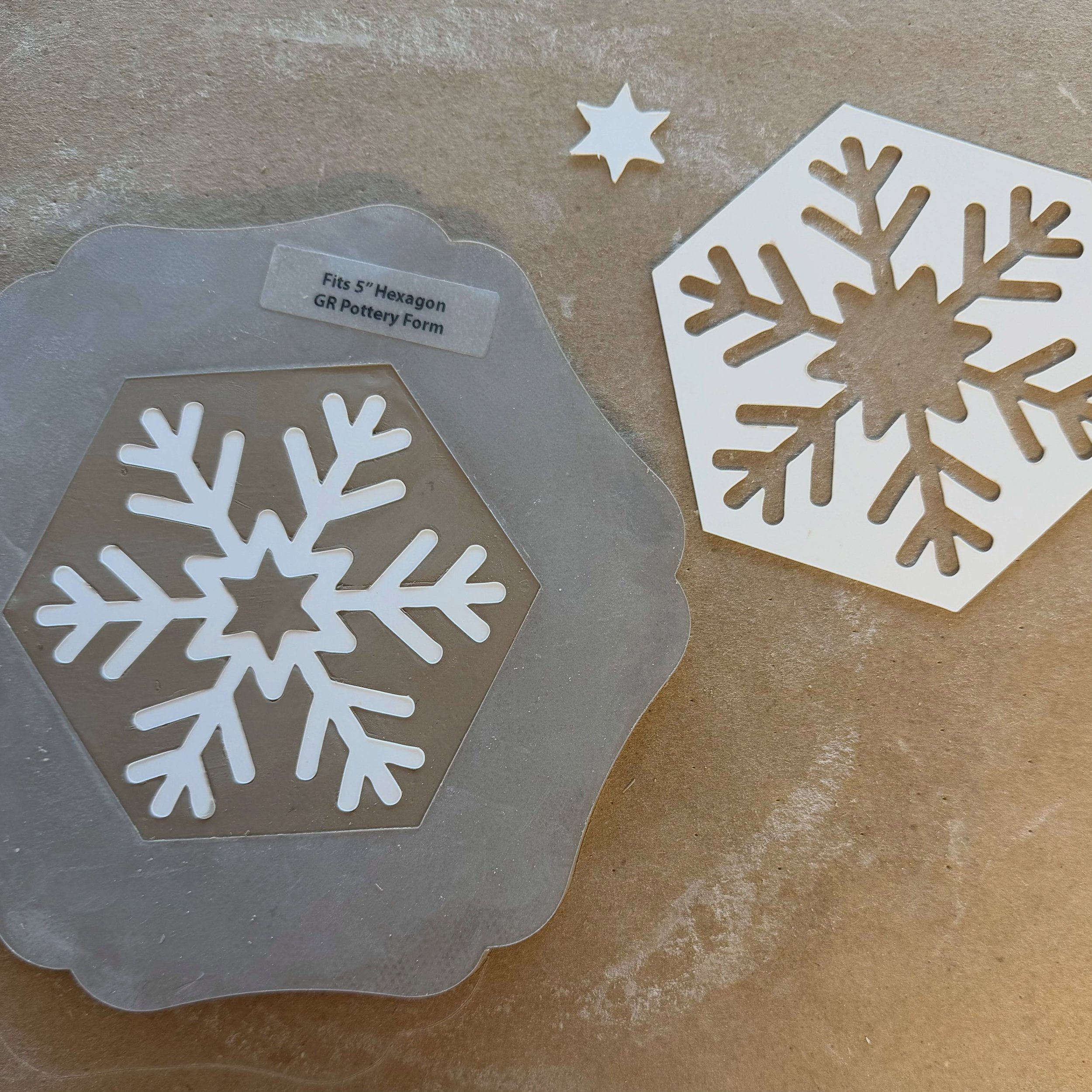 A peek at what I&rsquo;m working on: snowflake stencils! ❄️ This style fits the 5&rdquo; and 6.5&rdquo; hexagons from @gr.pottery.forms, perfect for making trinket dishes and small plates. Coming soon in at least six styles! #ceramics #christmas #orn