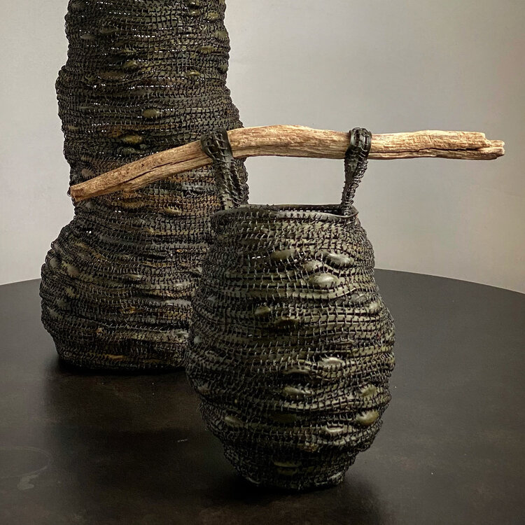 Two rockweed vessels with driftwood handles