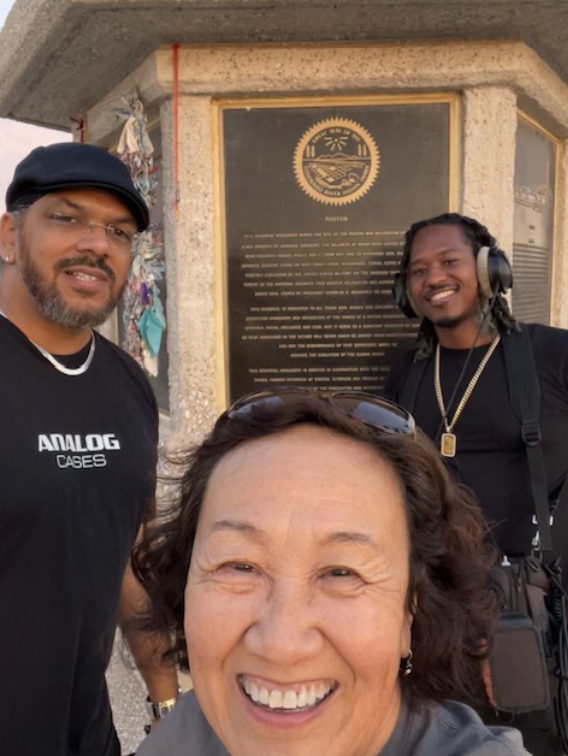 Showing documentary film crew around Poston…