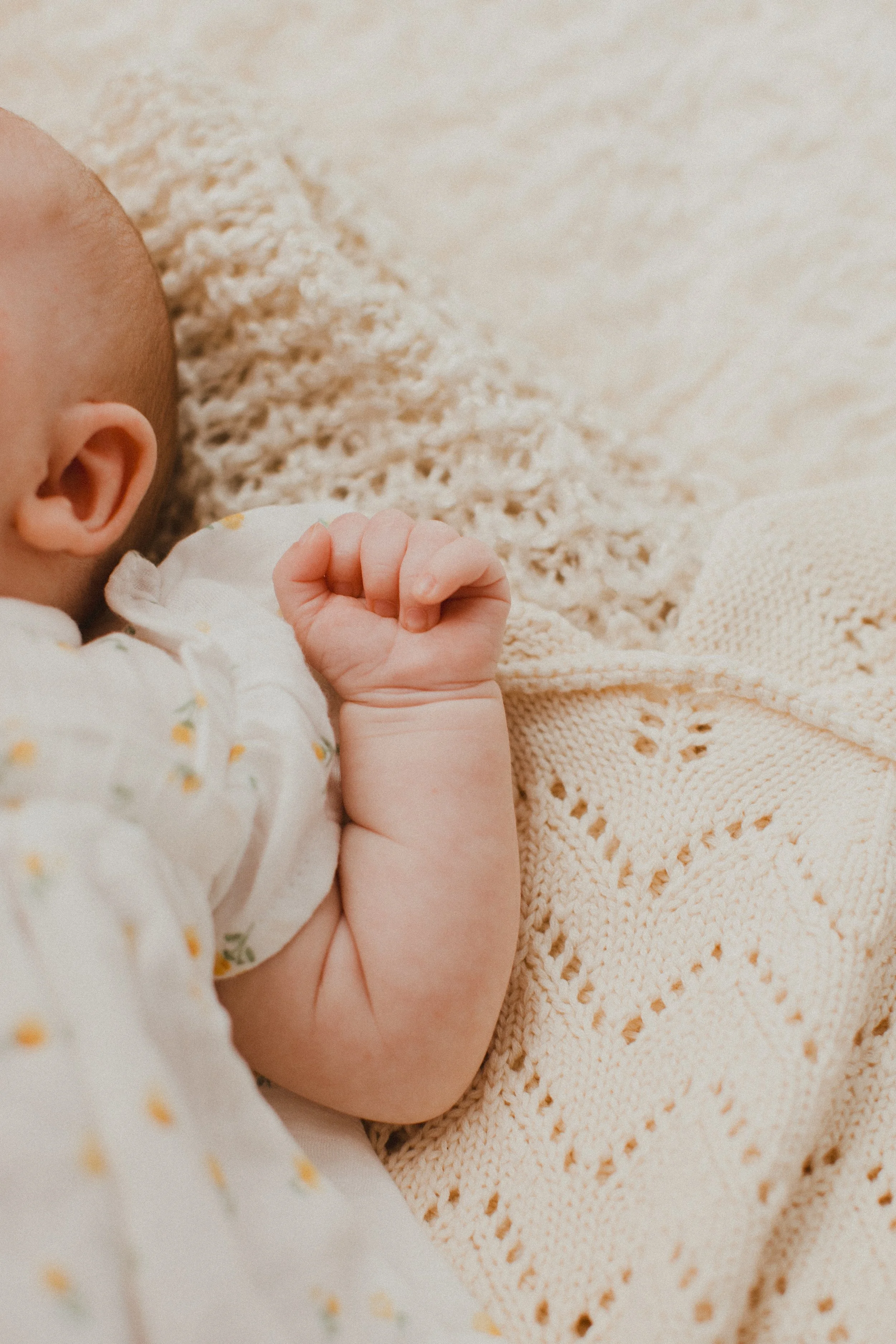 Evie newborn fists.jpg