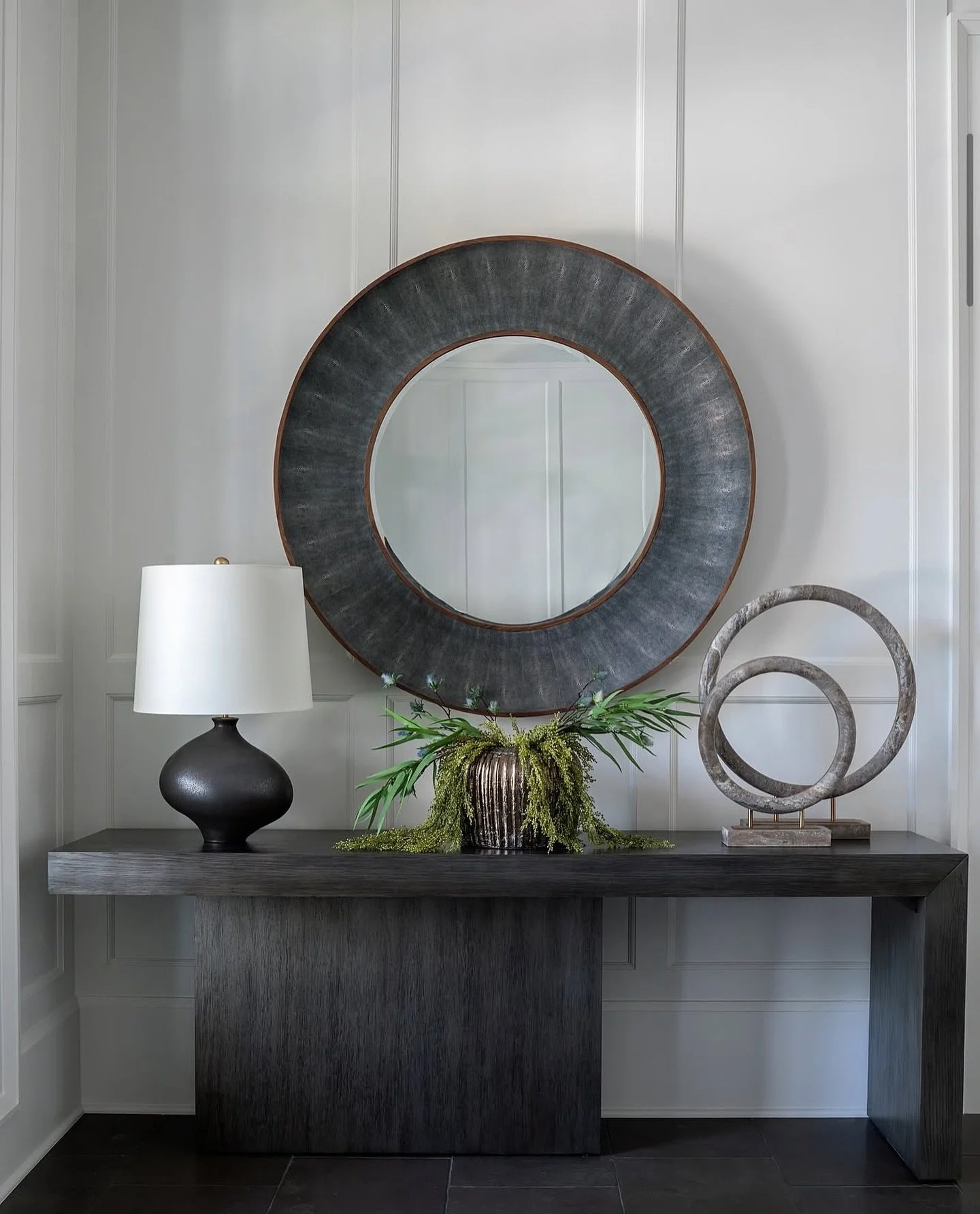 Kelly Caron creates an effortlessly moody foyer with muted tones of black and gray, accented by striking pieces like the @madegoods Armond mirror in classic faux shagreen. 

#madegoods
⁠
⭐️Designer: @kellycarondesigns⁠
📸Photographer: @kelliboydphoto