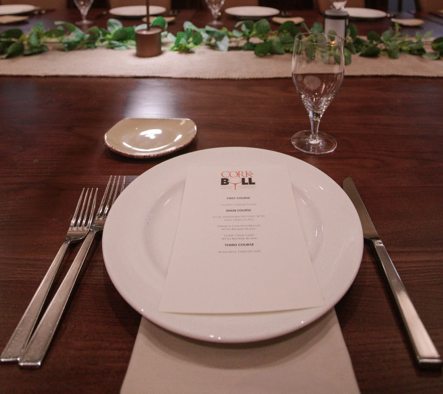 A place setting with a printed Cork & Bull menu