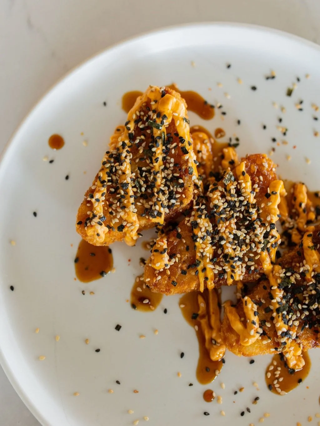 What we would order for the table if we were meeting friends + fam for brunch: FIRST, Umami Potatoes. Crispy fried hash browns, teriyaki ish drizzle, gochu aioli &amp; sesame seeeeeed. 

Sticky Cauliflower! What we are known for. Cauliflower nuggets 